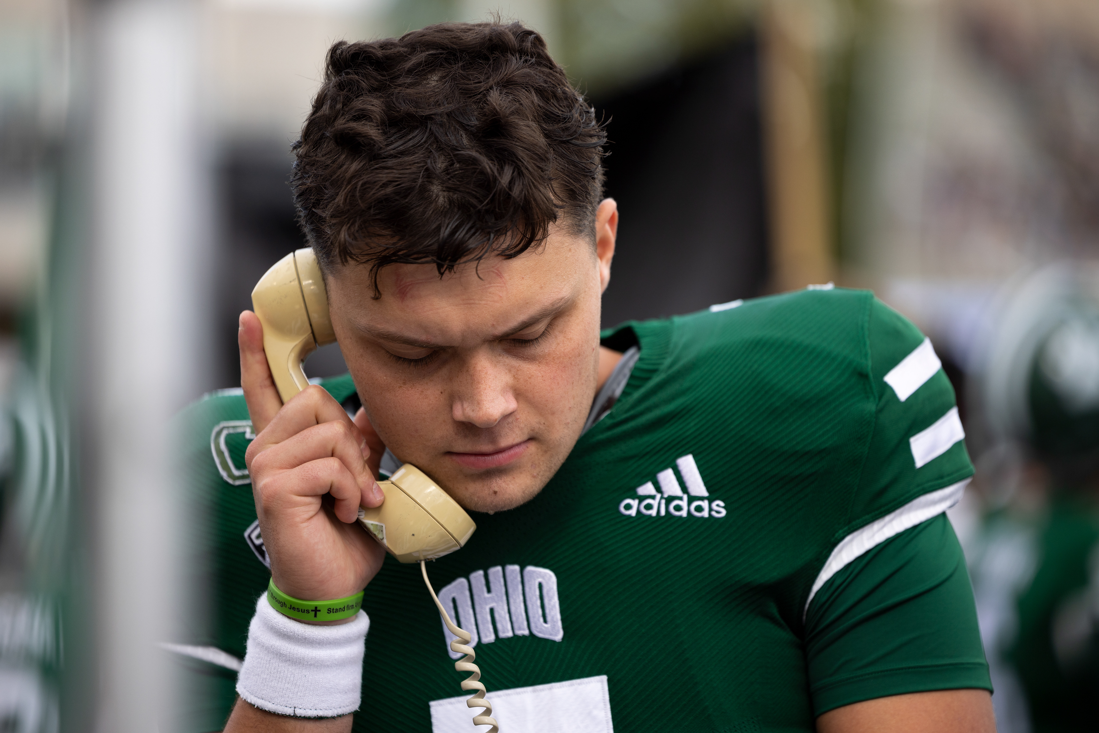 Ohio quarterback, Kurtis Rourke, talks to the staff above the field after his first drive against Kent State at Peden Stadium in Athens, Ohio, Oct. 7, 2023.