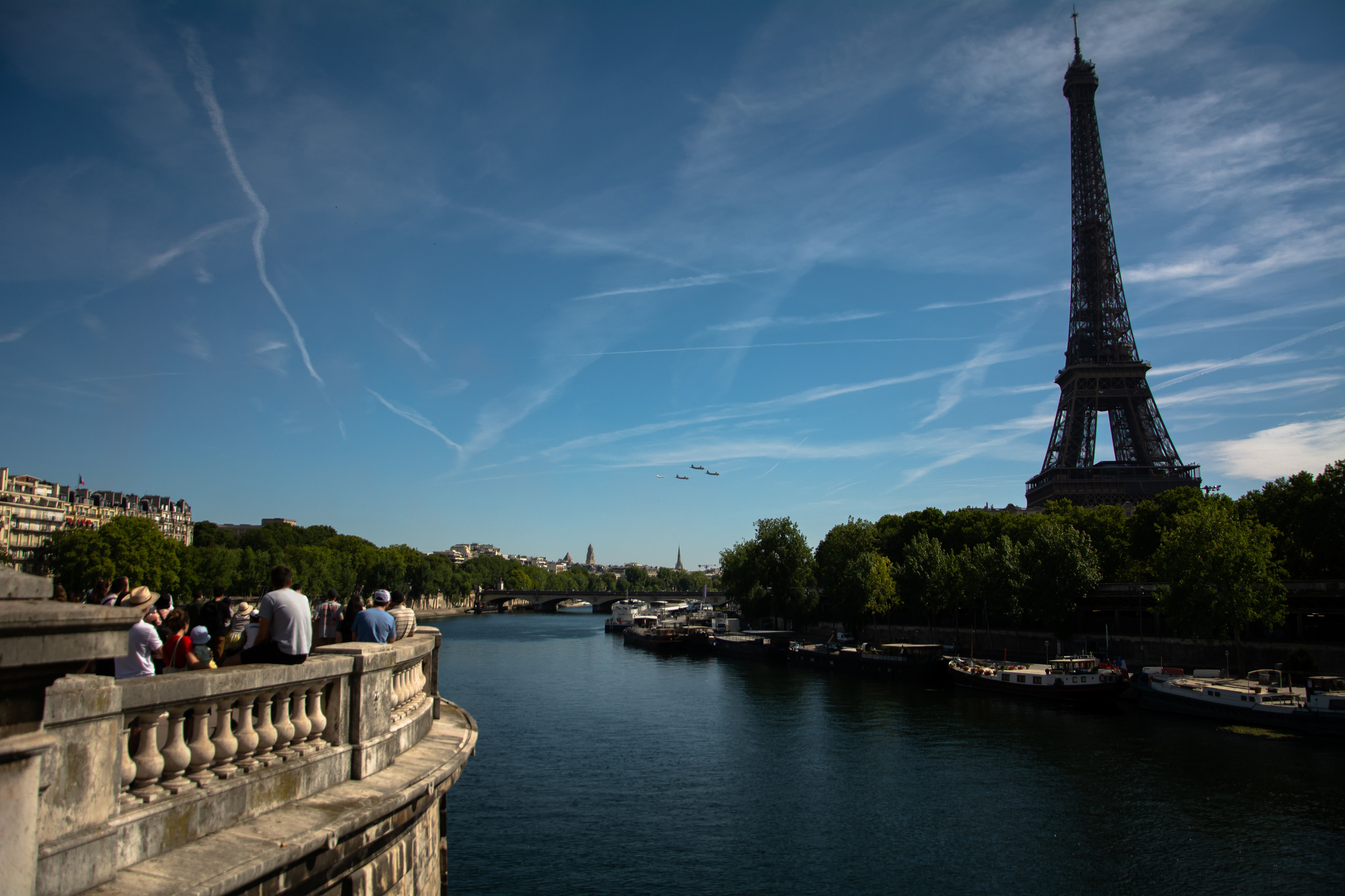 Patrouille de France releases smoke in the colors of the French flag as they fly behind Eiffel Tower during Bastille Day in Paris, on July 14, 2022.