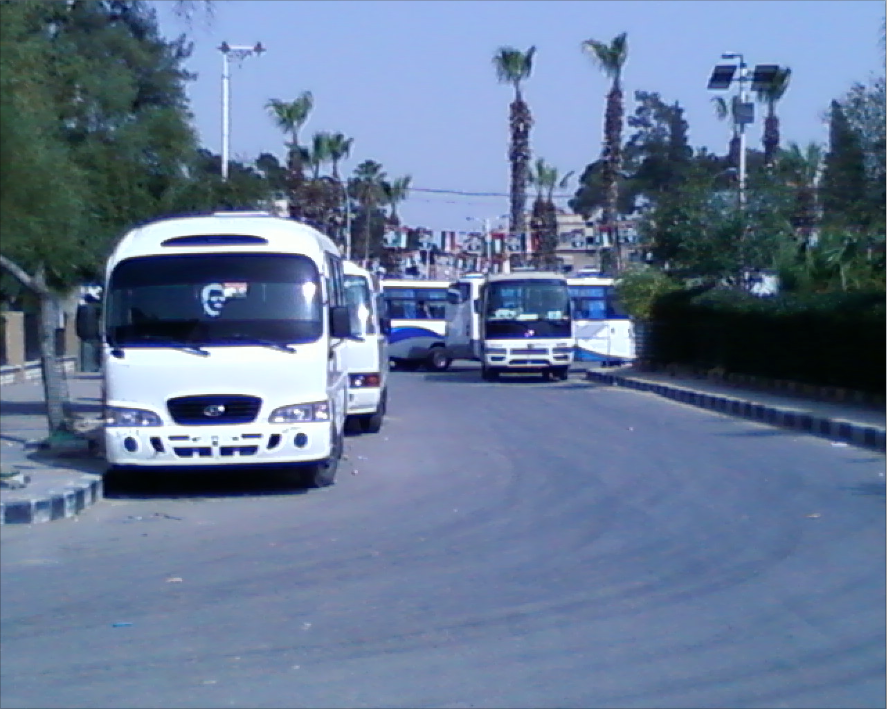The first photo I took on the 1st of April 2011. The photo shows the buses of "Shabbiha" blocking all access to downtown of Douma city wile they were committing the massacre inside. We could hear all the massive shooting. 12 civilians were murdered in that day.