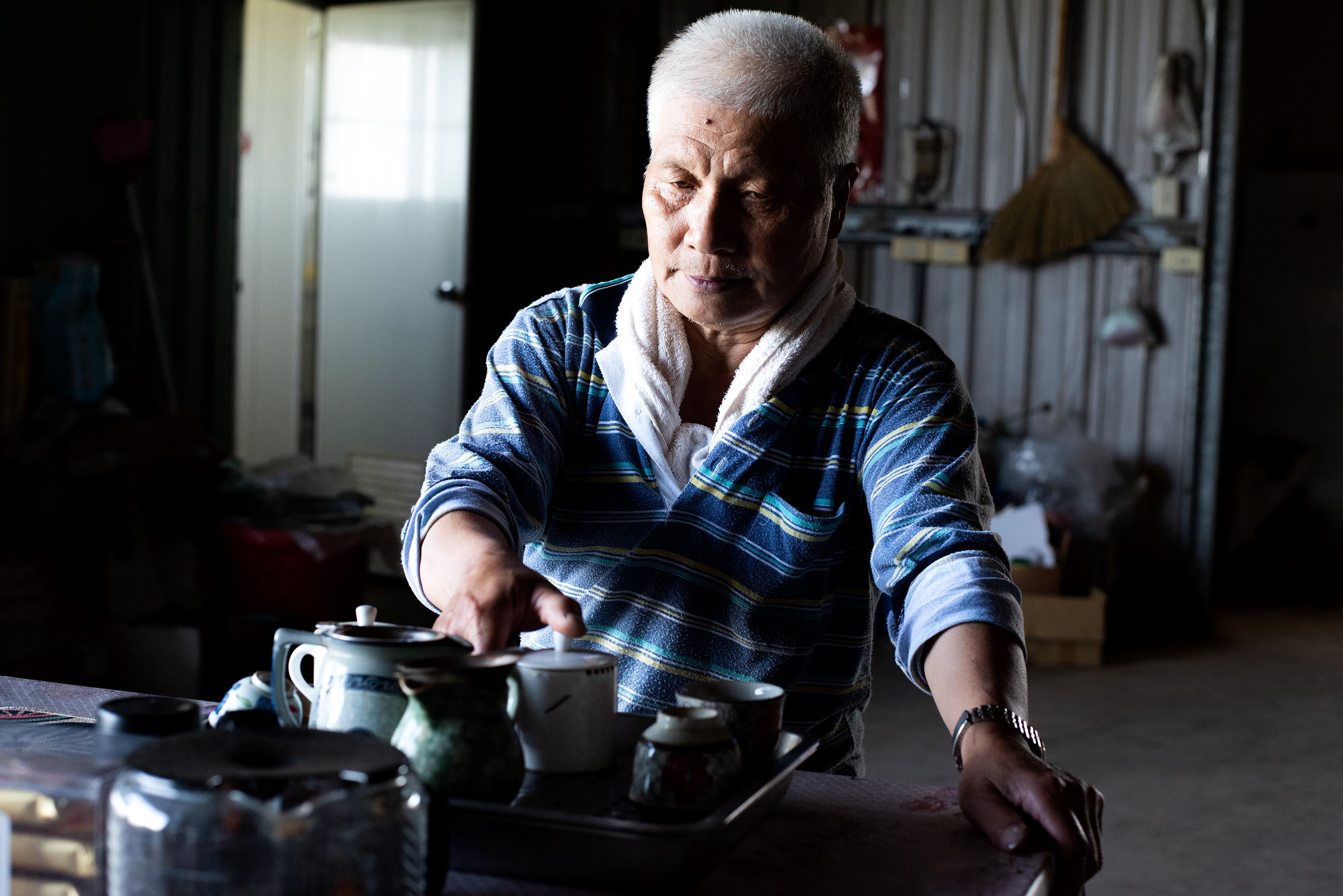an elderly tea farmer