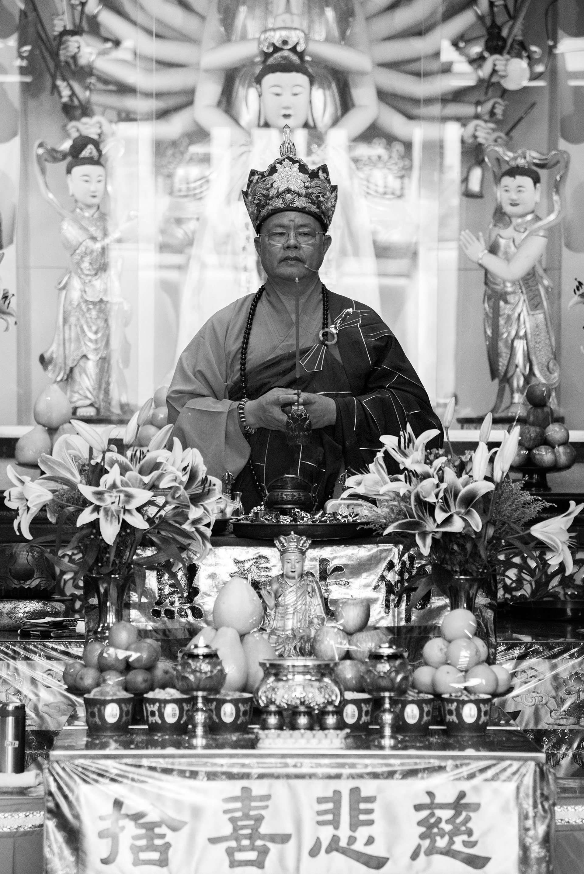 the elder monk of the temple offers a final blessing at the end of the ceremony