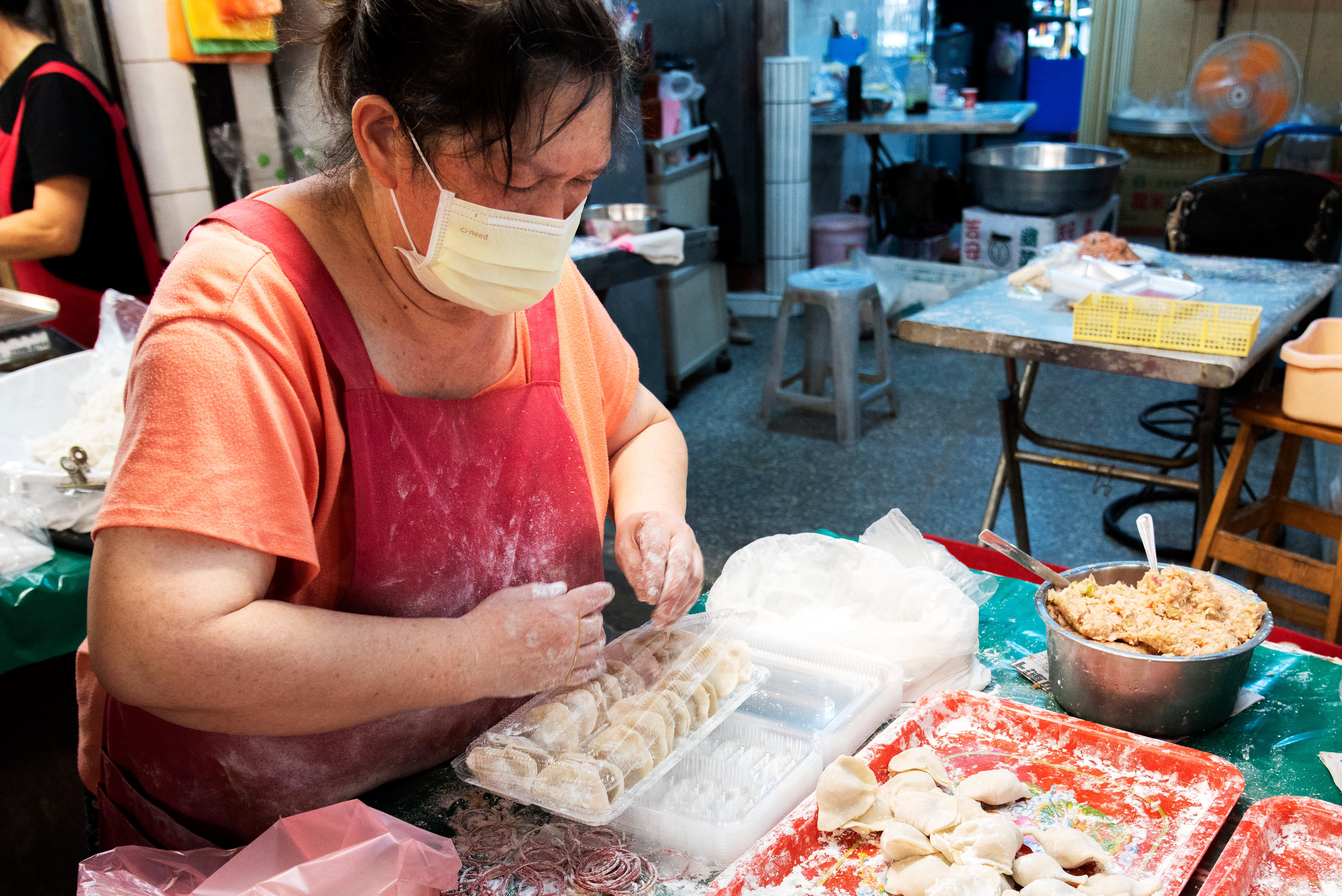 skilled hands craft dumplings at the local market
