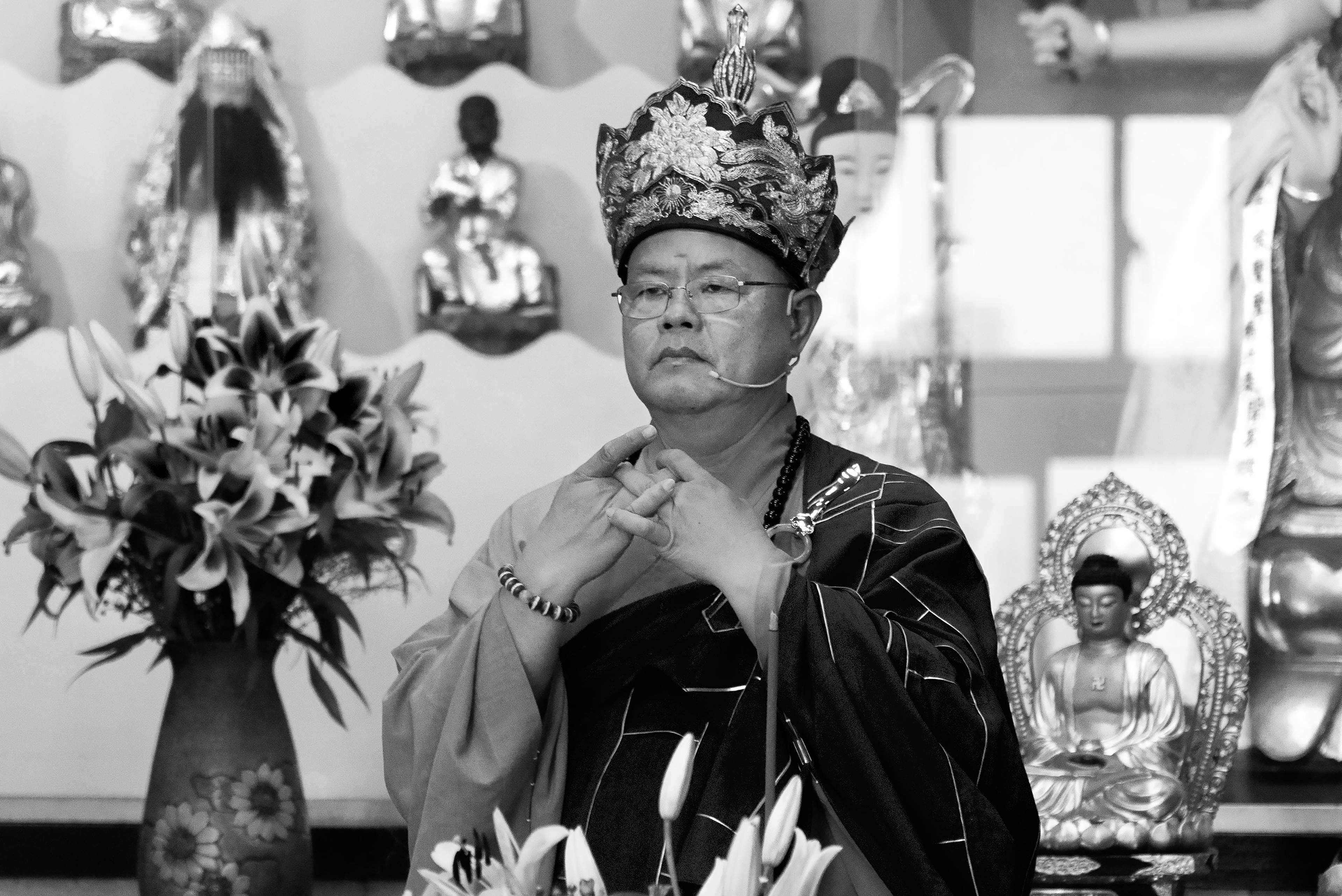 the elder monk of the temple during the prayer