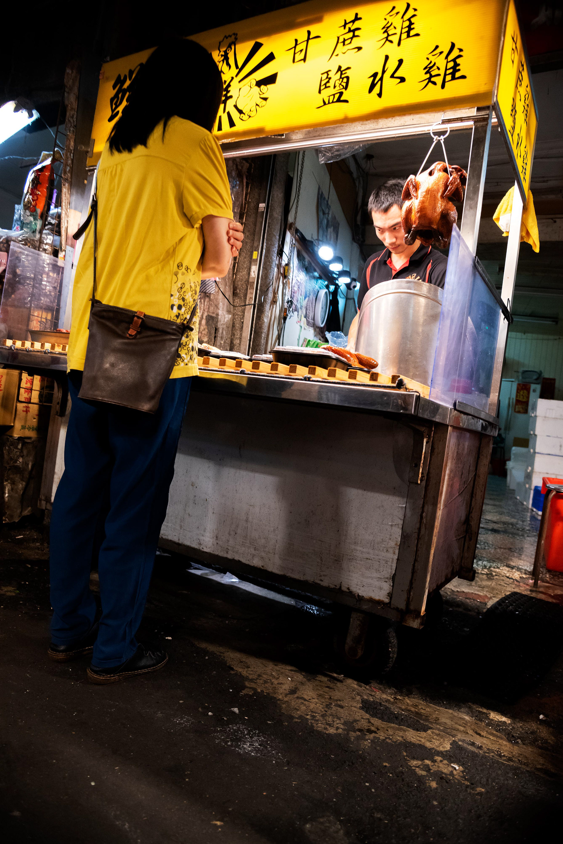 a roast duck seller at the local market