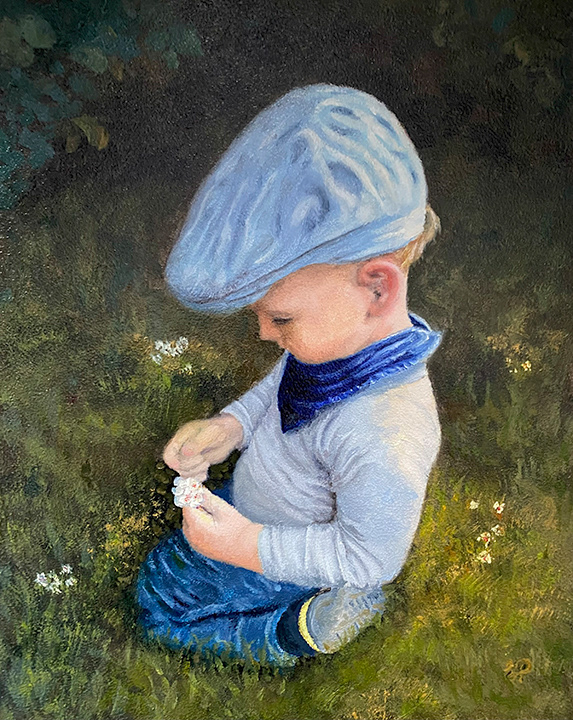 Little boy picking flowers sitting on his knees.