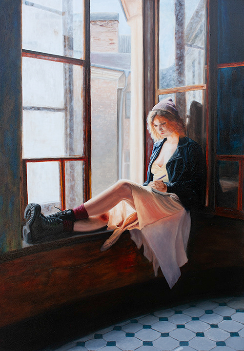 Young woman sitting on a window sill, writing in her diary. Sun is shining through an open window.