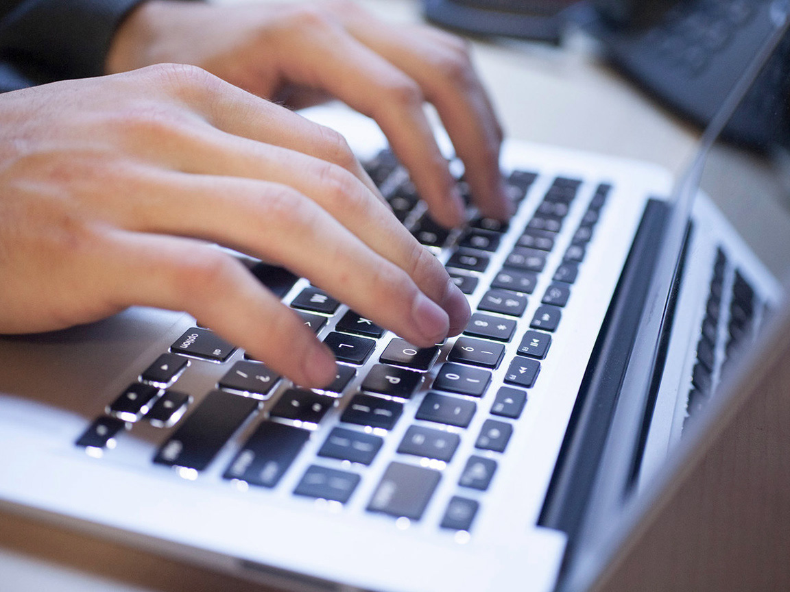 video editor and videographer on laptop
