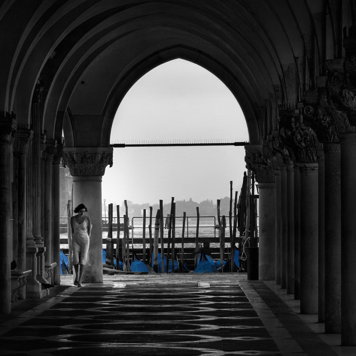 WOMAN AT DOGE'S PALACE  |  What began as a study of light, architecture, and solitude became something far more compelling. A lone woman appears at the edge of the frame, her elegant silhouette bringing life, scale, and mystery to the scene. In a city built on beauty and chance, this fleeting moment became the photograph.