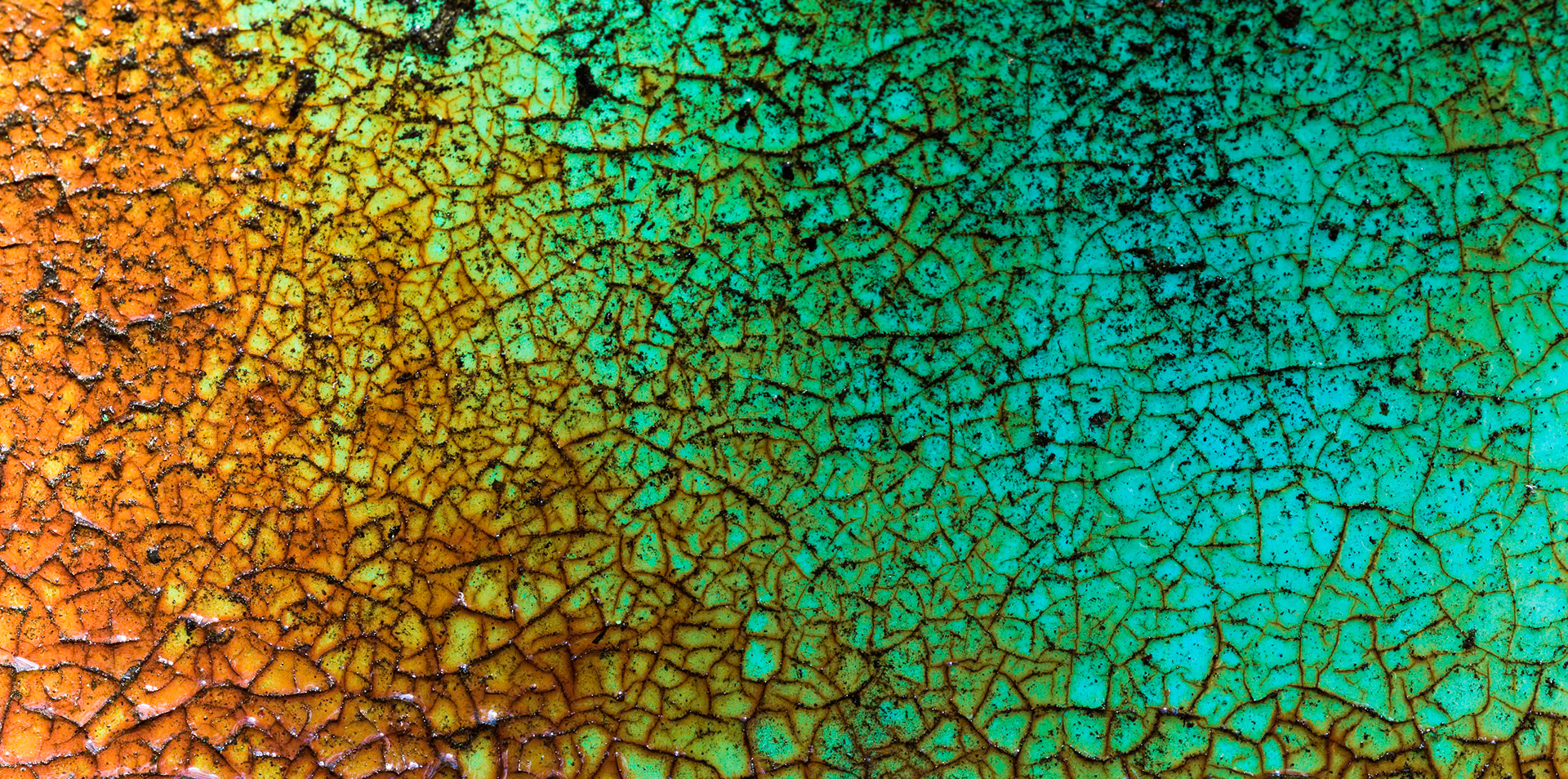 FRACTURED TURQ\UOISE  |  At first glance this appears to be an abstract painting, a collision of turquoise, gold, and amber fractured into thousands of tiny shapes. Only on closer inspection does the truth emerge: this is weathered automotive paint, transformed by decades of sun, rain, and oxidation into a natural mosaic that no artist could deliberately recreate.The image celebrates the beauty hidden within decay. What was once a smooth, glossy surface has cracked into a landscape of intricate patterns and vibrant color, proving that time is not always a force of destruction. Sometimes it is a remarkably talented artist.