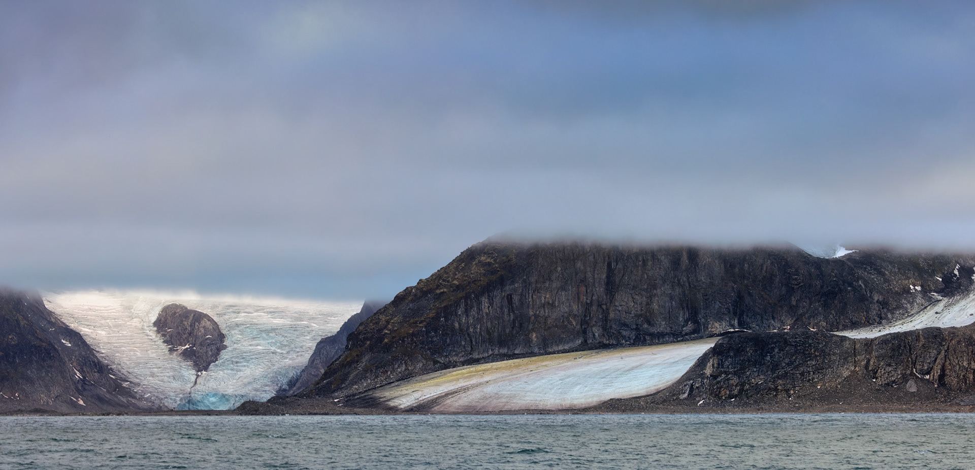 GLACIER VEILED IN ARCTIC FOG