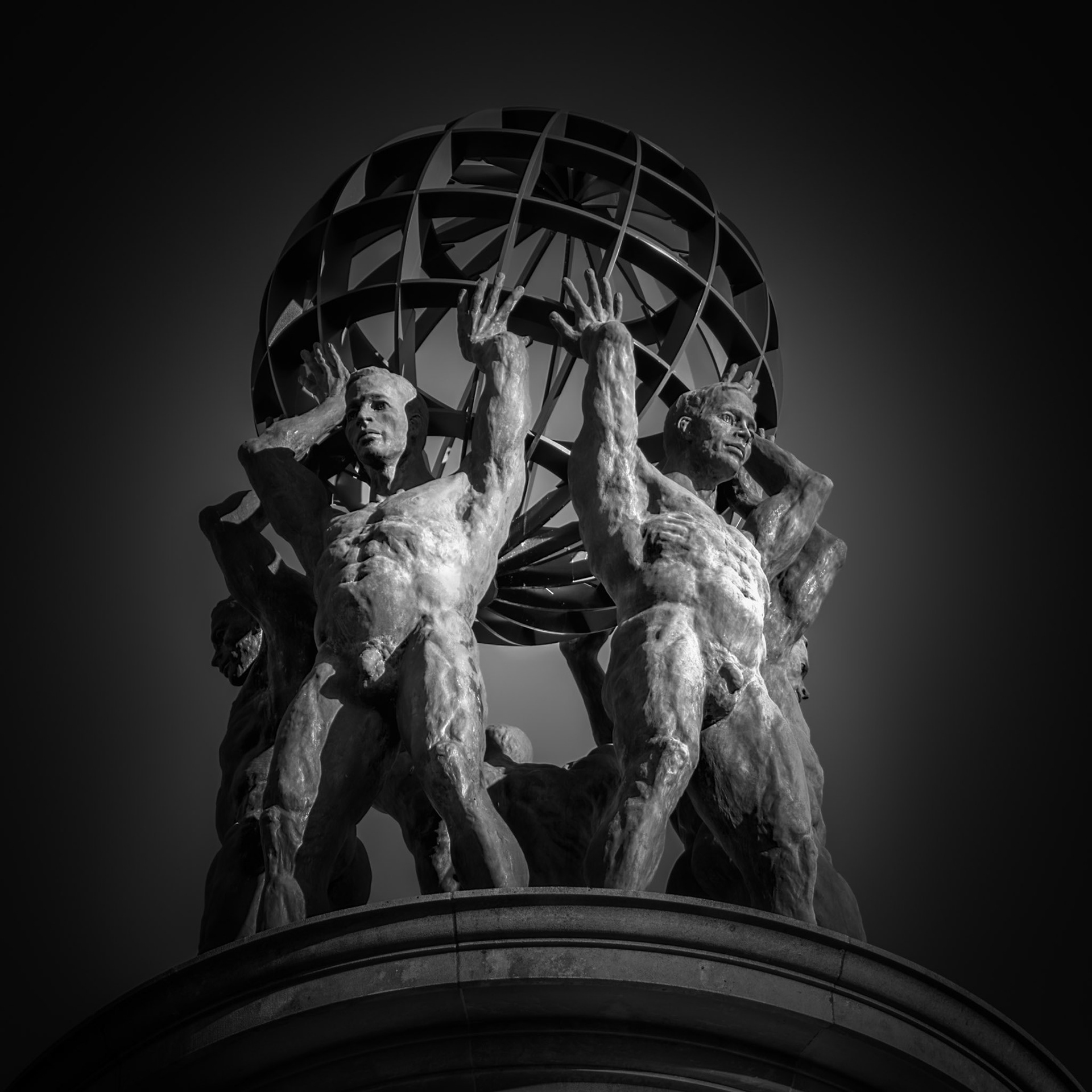 WEIGHT AND BALANCE  |  Bathed in shadow and light, Atlanta's iconic Atlas appears both powerful and contemplative. The sculpture's enduring presence has made it one of the city's most photographed and recognizable works of public art.