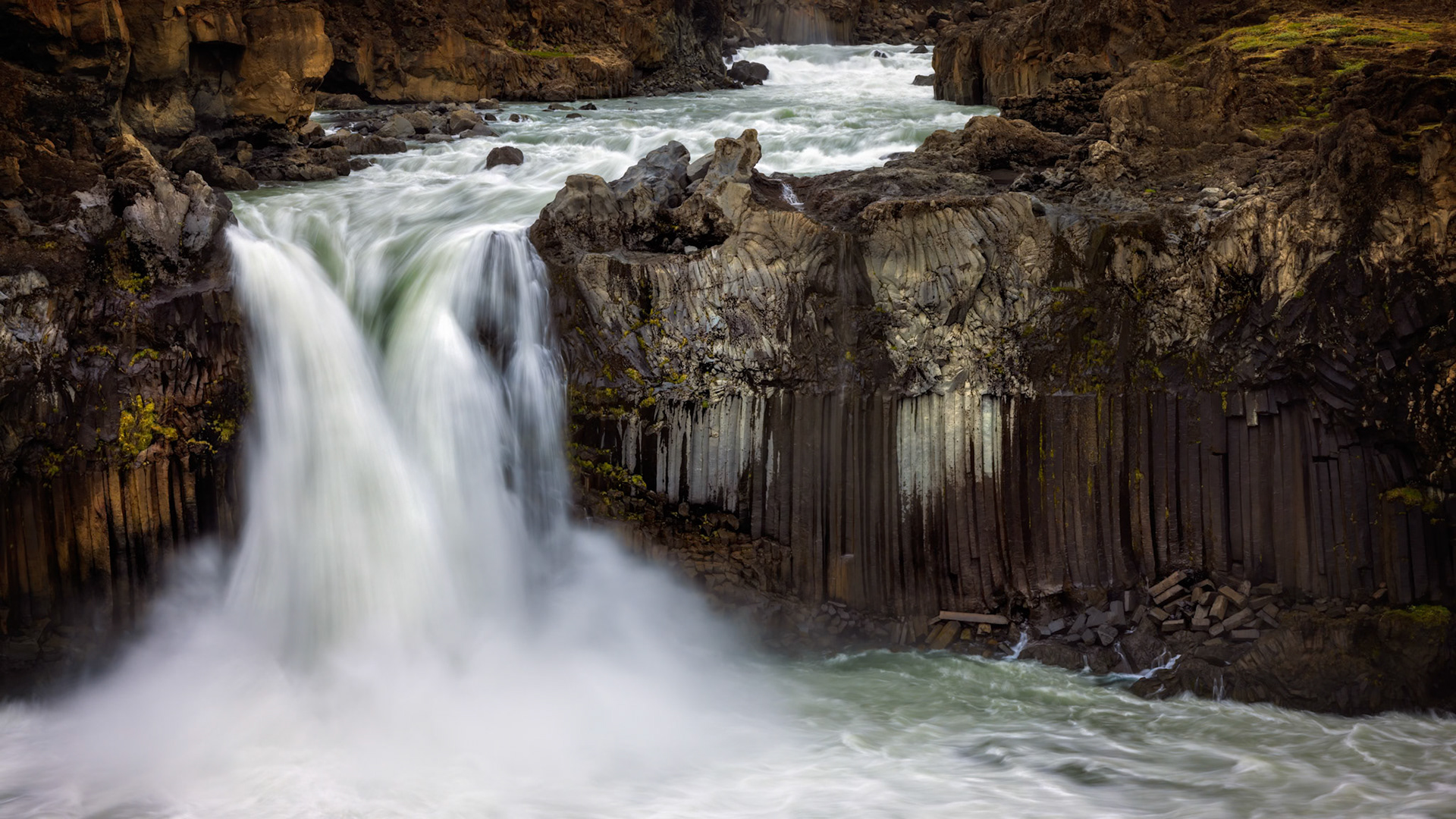 ALDEYJARFOSS  |  Few waterfalls capture the spirit of Iceland quite like Aldeyjarfoss. Emerging from the rugged highlands, the powerful cascade plunges into a canyon lined with remarkably symmetrical basalt columns, where fire and water have spent millennia shaping the landscape together.