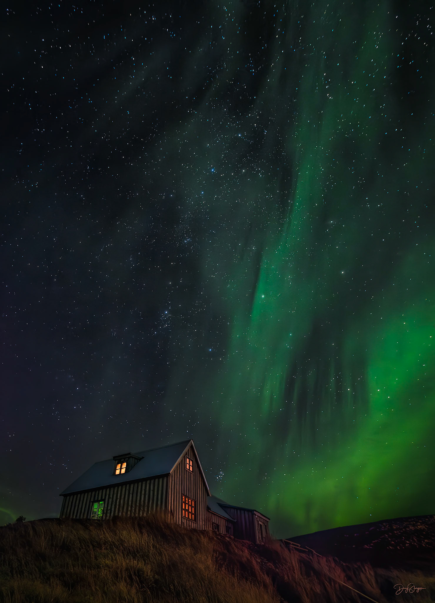 DANCING IN THE STARS  |  Few experiences compare to witnessing the northern lights in Iceland's remote highlands. Far from towns and artificial light, the night sky comes alive as curtains of green aurora drift across a sea of stars above a solitary mountain cabin.
