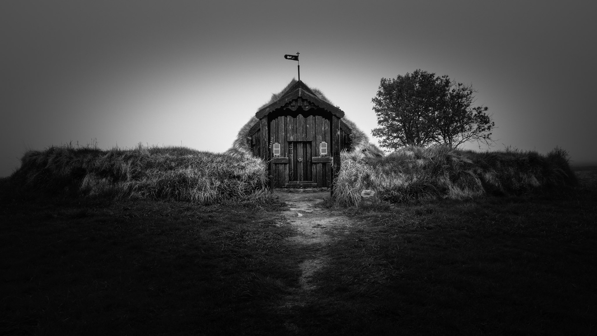 HIDDEN CHAPPEL  |  Weathered by centuries of wind, rain, and northern winters, this traditional Icelandic turf church seems to rise naturally from the landscape itself. Built from timber, earth, and grass, it reflects a time when survival depended on living in harmony with the harsh environment.