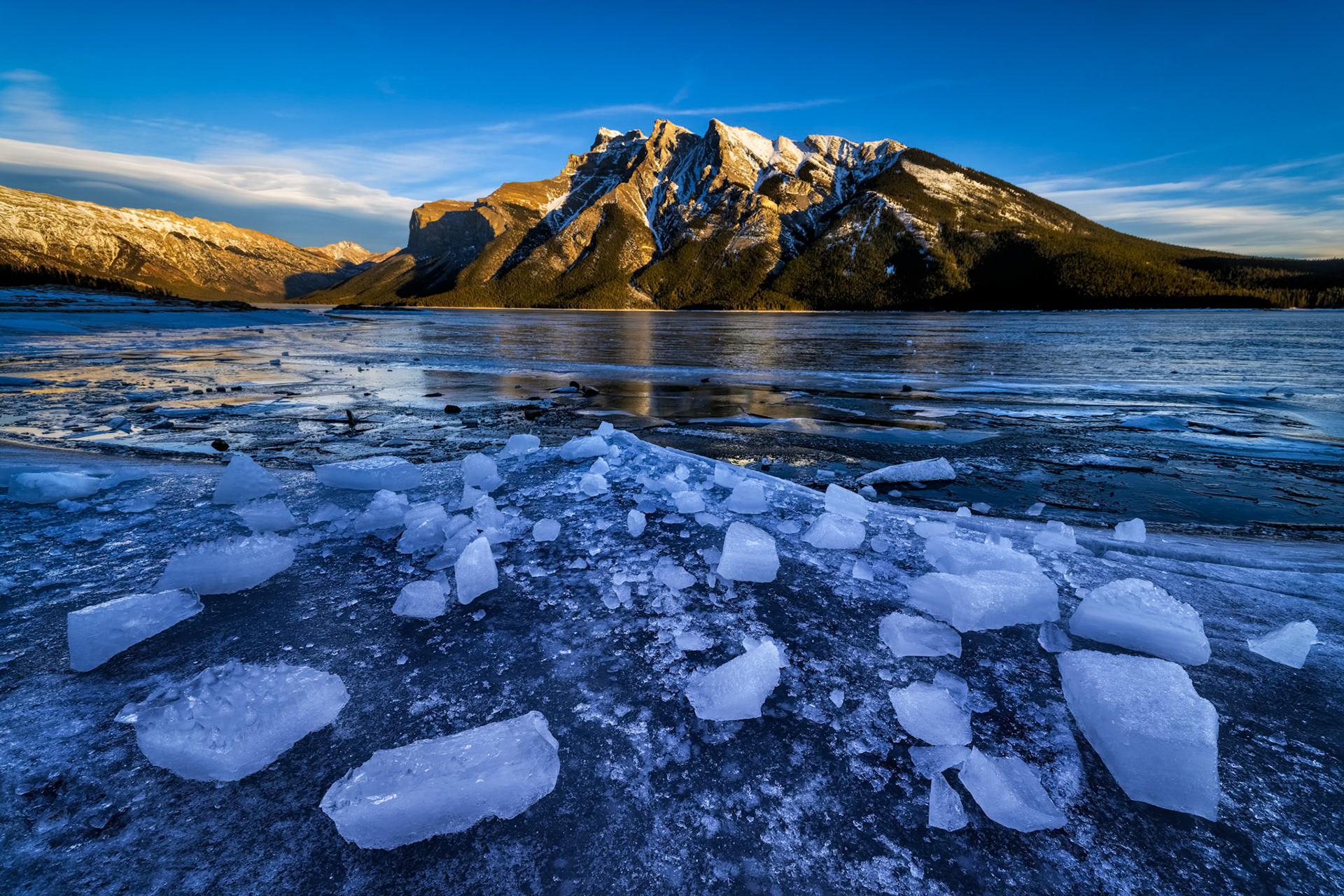 BEFORE THE THAW  |  Abraham Lake is famous for its winter ice, but what makes the experience unforgettable is witnessing a landscape that appears frozen and in motion at the same time. Along the shoreline, powerful winds, shifting temperatures, and the constant expansion and contraction of the lake transform a solid sheet of ice into a mosaic of fractured forms.