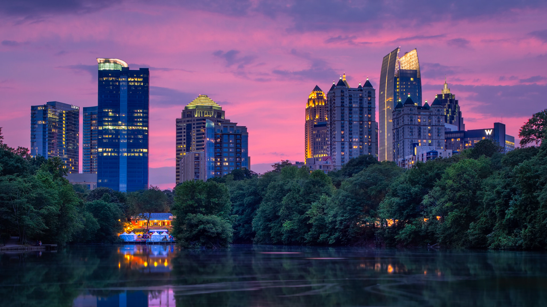 SUNSET OVER MIDTOWN  |  Clara Meer has always been one of my favorite places to watch Atlanta transition from day to night. On this evening, the city seemed almost secondary to the sky. Shades of purple, pink, and blue stretched across the horizon while the first lights of Midtown began to glow through the trees.What isn't obvious from the image is how still the lake was. The surface acted like a mirror, reflecting both the skyline and the fading colors overhead. For a few minutes, the city felt unusually quiet, despite thousands of people moving through the streets just beyond the park.Scenes like this are a reminder of why Atlanta is often called a city in a forest. Even as the skyline continues to grow, moments like these reveal a softer side of the city, where nature, water, and architecture come together in a way that feels uniquely Atlanta.