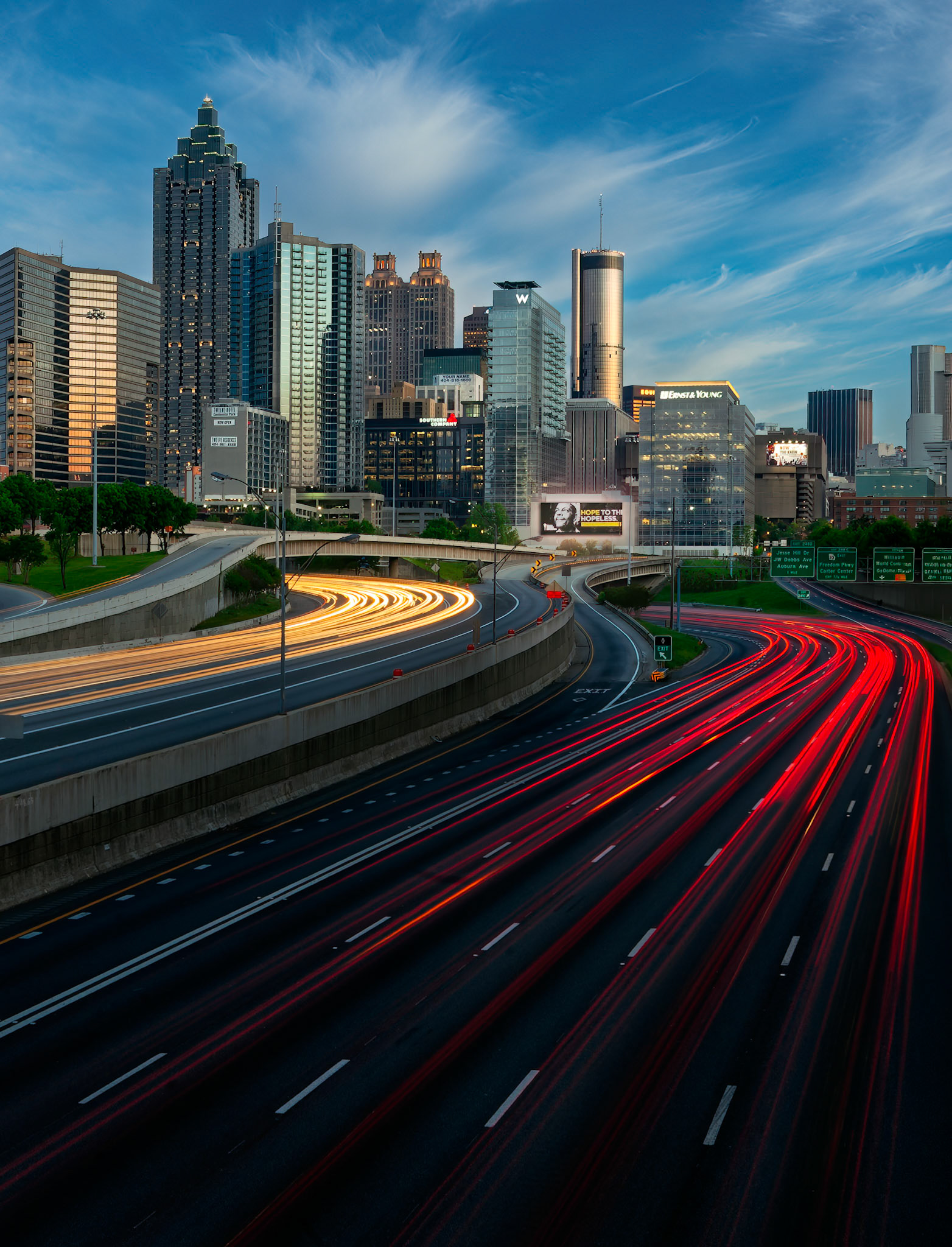 HEARTBEAT OF ATLANTA  |  Day and night, the lifeblood of Atlanta flows through these lanes. Streams of headlights and taillights weave through the city, connecting neighborhoods, businesses, dreams, and destinations in a constant rhythm that never truly stops.What drew me to this scene was the sense of motion. The long exposure transforms ordinary traffic into rivers of light, creating a visual pulse that mirrors the energy of the city itself. Above the movement, Atlanta's skyline stands as a testament to growth, ambition, and reinvention.Cities are often defined by their landmarks, but they are sustained by movement. Every streak of light represents someone heading home, beginning a journey, pursuing an opportunity, or simply living their daily life. Together they form the invisible threads that bind a city together.This image captures Atlanta as I often see it: vibrant, dynamic, and constantly in motion. The skyline provides the structure, but the highways provide the heartbeat.