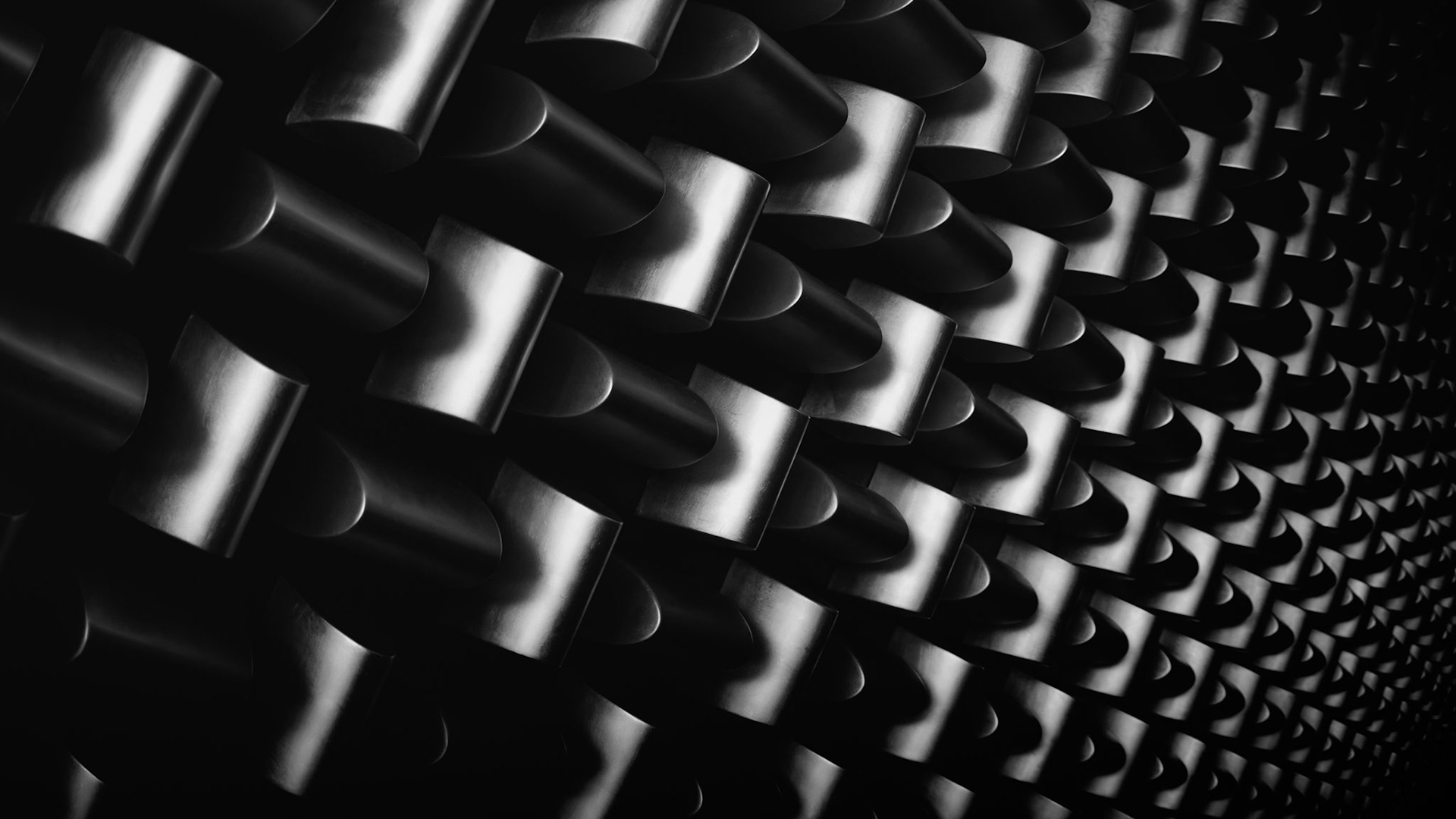 REPETITION IN SHADOW  |  What began as a decorative wall became an exploration of light, shadow, and repetition.Walking through the Mandarin Hotel in Las Vegas, I was immediately drawn to this architectural detail. Most guests likely passed by without a second glance, yet the sculpted surface seemed to come alive as light grazed across its curves and edges.The design itself is relatively simple: repeating geometric forms arranged in a precise pattern. But when illuminated from the side, the wall transforms into something far more dynamic. Highlights emerge from darkness, shadows deepen, and the repeating shapes create a visual rhythm that appears to flow endlessly beyond the frame.I have always been fascinated by abstract subjects because they challenge us to see differently. Without a recognizable landmark or familiar object, the viewer is invited to focus on form, texture, contrast, and movement. The image becomes less about what we are looking at and more about how it makes us feel.To me, the wall resembles a woven fabric of steel, simultaneously rigid and fluid. The repeating pattern creates order, while the changing light introduces mystery and depth.Sometimes the most compelling photographs are not of grand vistas or famous landmarks. They are found in the overlooked details that surround us every day, waiting for the right light to reveal their hidden beauty.