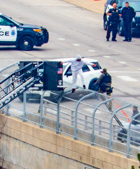 Omaha police arrested a man who climbed onto the fence of the Farnam Bridge over Interstate 480 while experiencing a mental health crisis Friday (March 31, 2023).Northbound Interstate 480 was shut down for nearly nine hours while officers assisted the man, identified as 46-year-old Frederick Patterson. (KETV 7)I spent several hours watching this drama unfold today. The situation started just before 8:00 this morning and ended just before 5:00 this evening. The Omaha Police and Fire/Rescue teams exhibited outstanding patience and professionalism in their handling of the situation.Let's hope that Mr. Patterson can find some peace, love, and understanding while obtaining professional help with his issues.