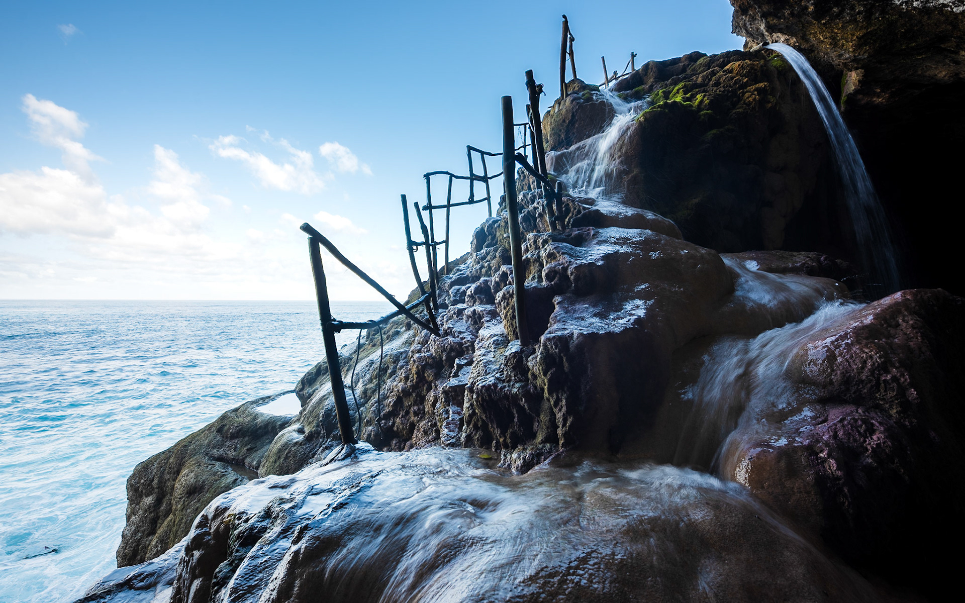 Fresh water pool pouring in the sea, Nusa Penida