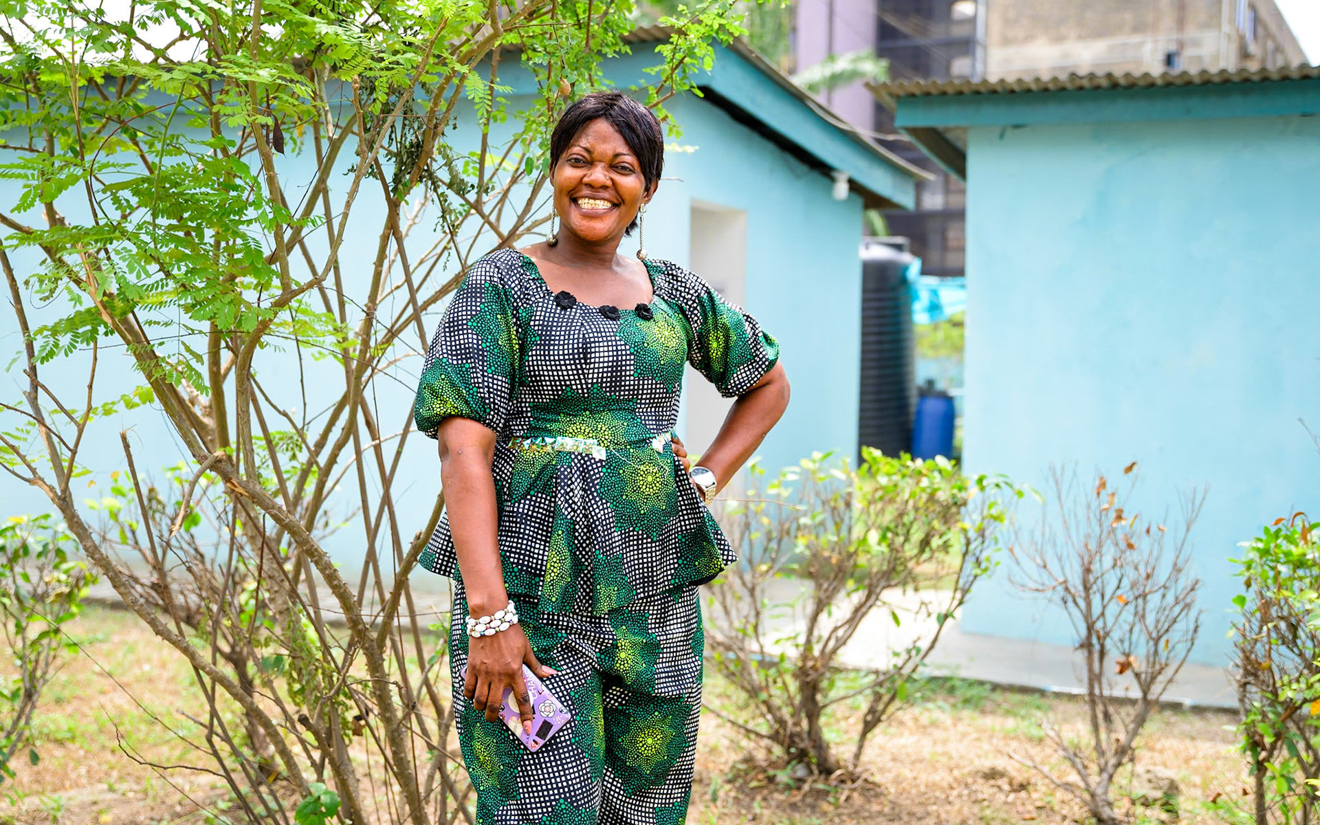 Mbusthu Djunga (Djunna) Cherabo poses for a portrait in UNHCR office in Lagos, Nigeria. A refugee from DR Congo, she now manages a small convenience store in Ikorodu, Lagos State. Having struggled during the Covid-related lockdowns, concerned about her son's recent disappearance, she now faces the current economic crisis, on her own. She still hopes to stay out of debt as she's paying back a loan facilitated by UNHCR's local partners.PoC: Refugee