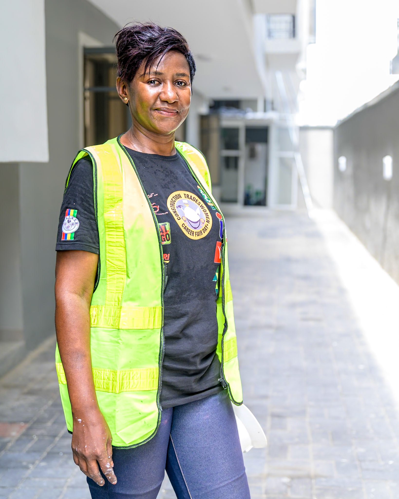 Mpela Leontin Ndonda, a refugee woman, poses on her workplace in Lagos, Nigeria. After a professional training supervised by UNHCR, she works full time as a painter contractor and hopes to create her own company soon thanks to UNHCR's partners help and loans. Interbau Foundation in Nigeria has trained more than 2700 women in construction crafts in 2021.PoC: Refugee