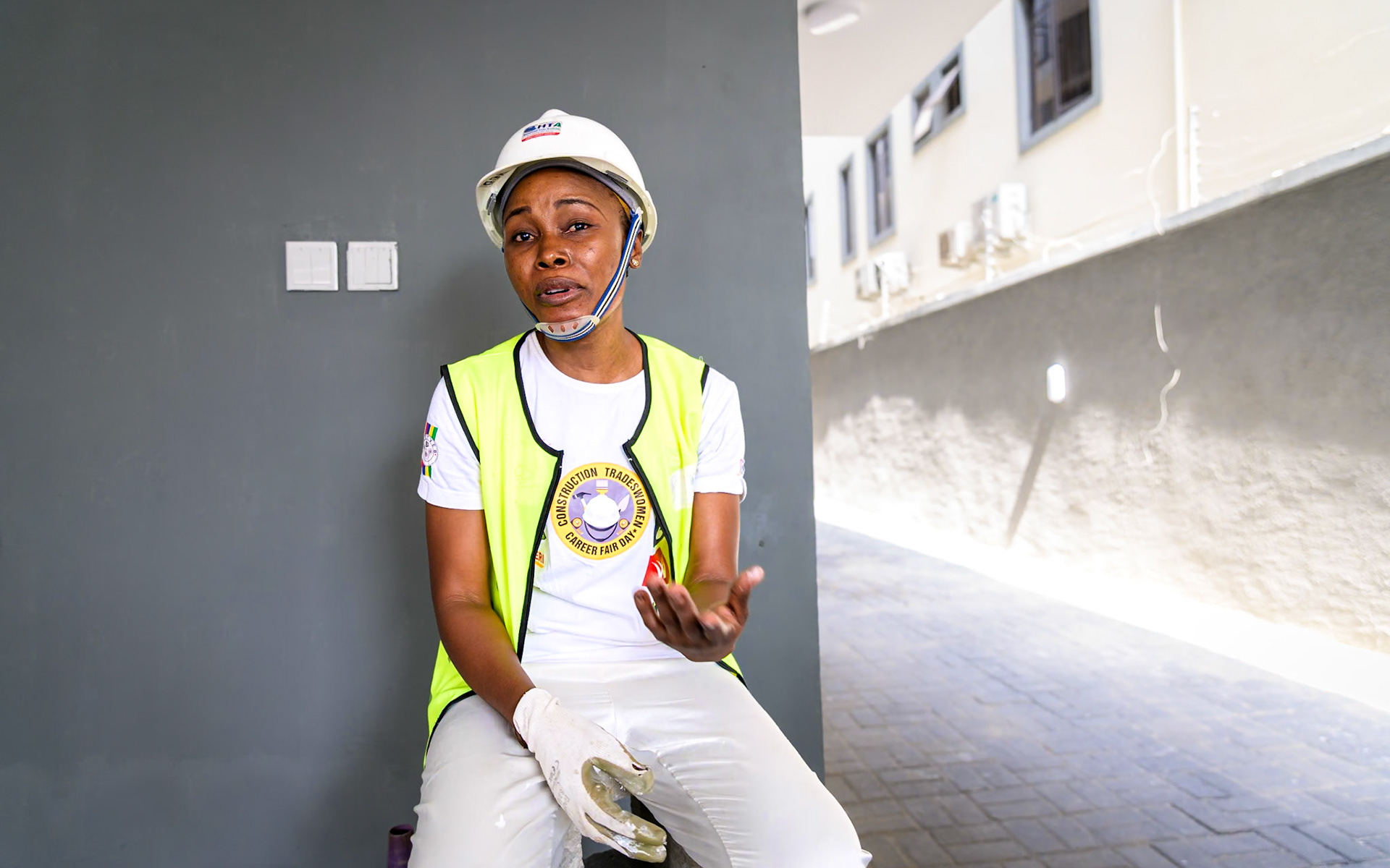 Luti, a refugee from Central African Republic, poses on her workplace in Lagos, Nigeria. After a professional training supervised by UNHCR, she works full time as a painter contractor and hopes to create her own company soon thanks to UNHCR's partners help and loans. Interbau Foundation in Nigeria has trained more than 2700 women in construction crafts in 2021.PoC: Refugee