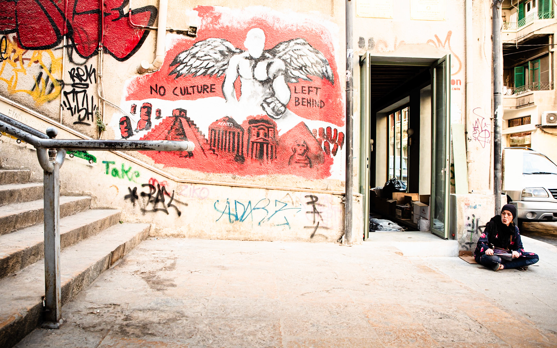 Beirut, Lebanon -  Sep 2018: Street beggars, decaying shops and wall art on Saint Nicolas stairs, Beirut, Lebanon