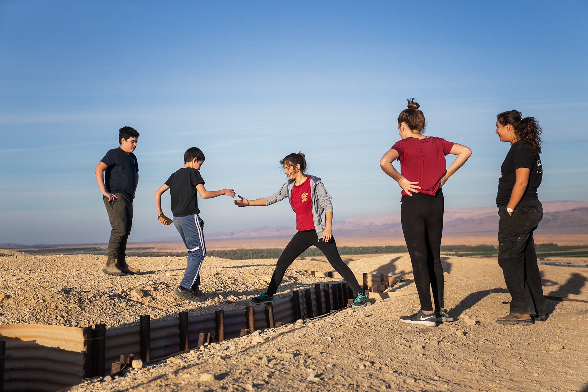 Suf help Elad across a trench