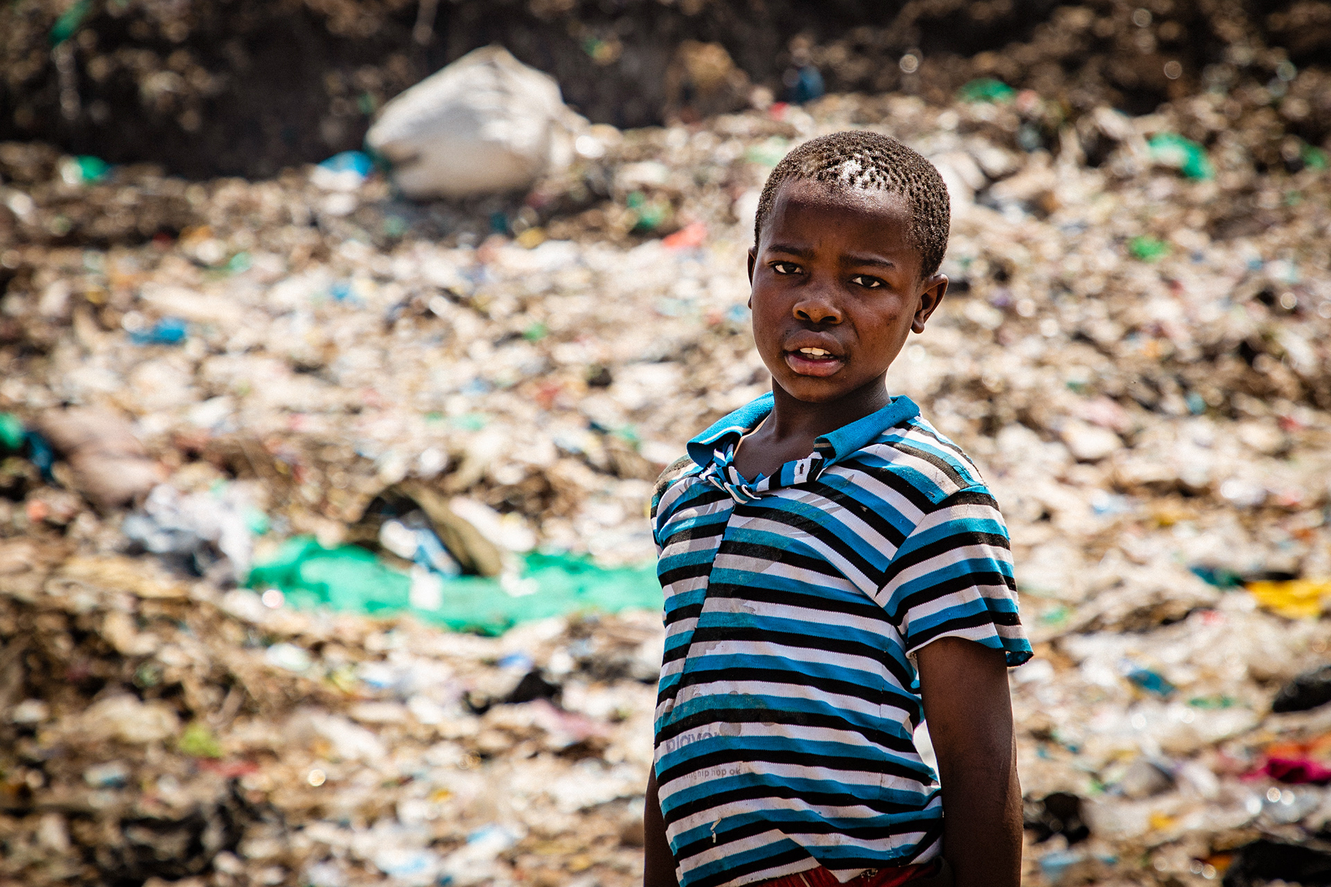 Many of the people looking for recyclables are children, drawn from the slums that surround the area, who skip school either by their own accord or someone else's orders to make money.
