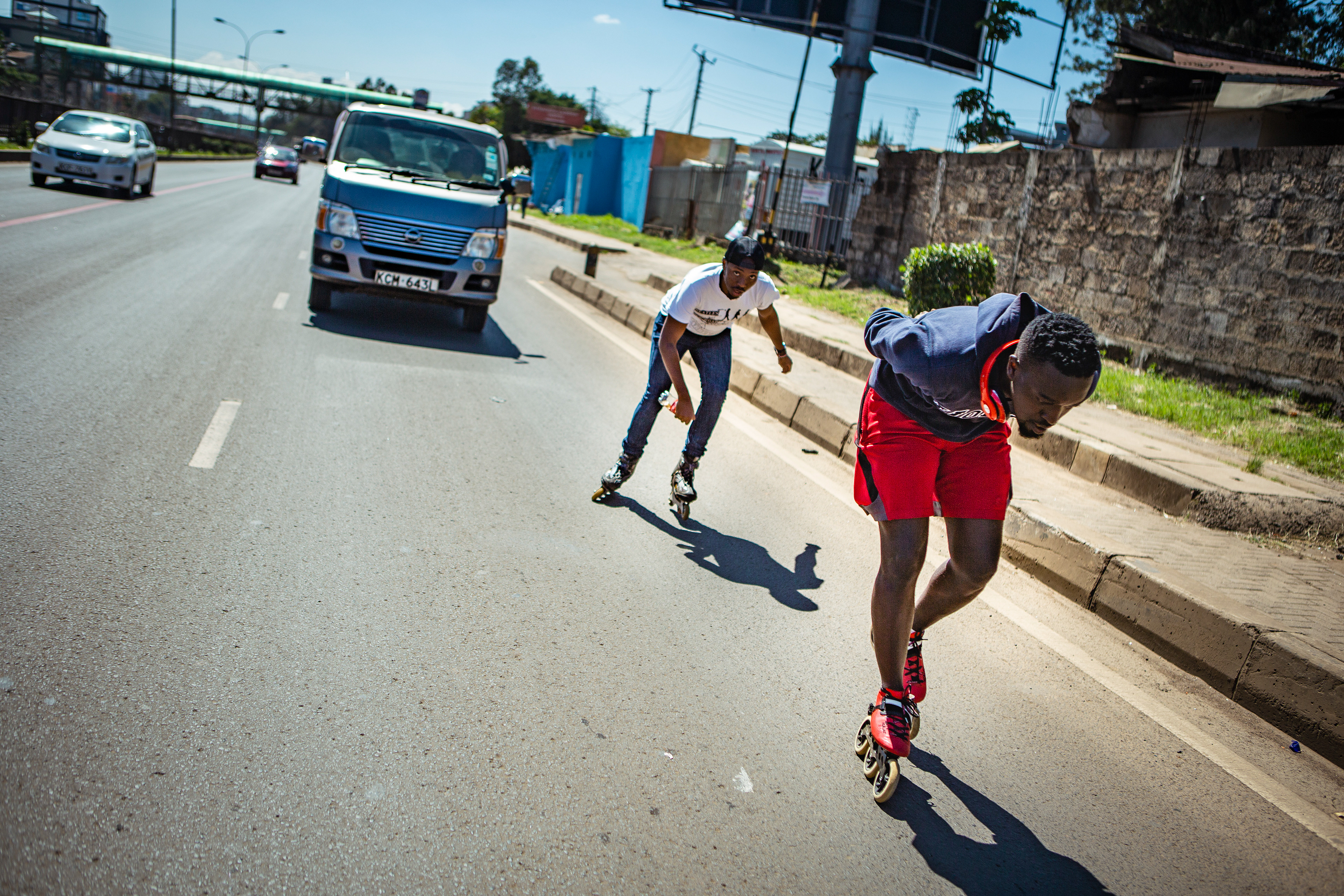 Lenny Alvin drafts behind Allan Ayigah on Nairobi’s Thika superhighway.