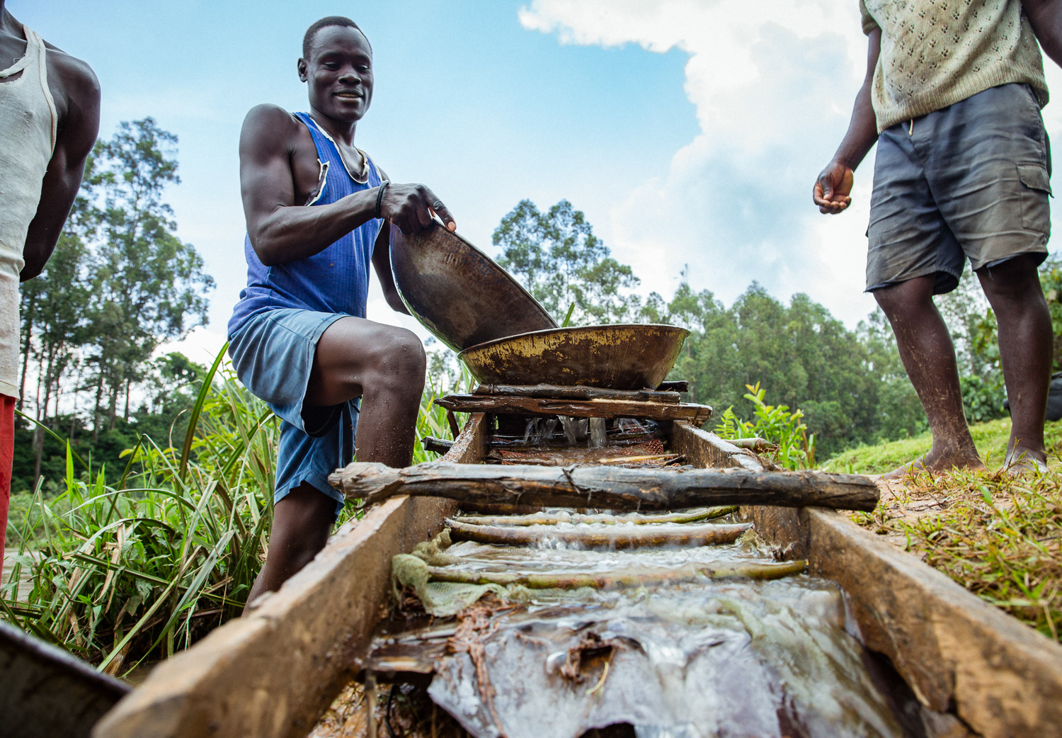 Miners illegally panning for gold on the River Galgol, outside of the town of Khayega in Kakamega County, Kenya.
