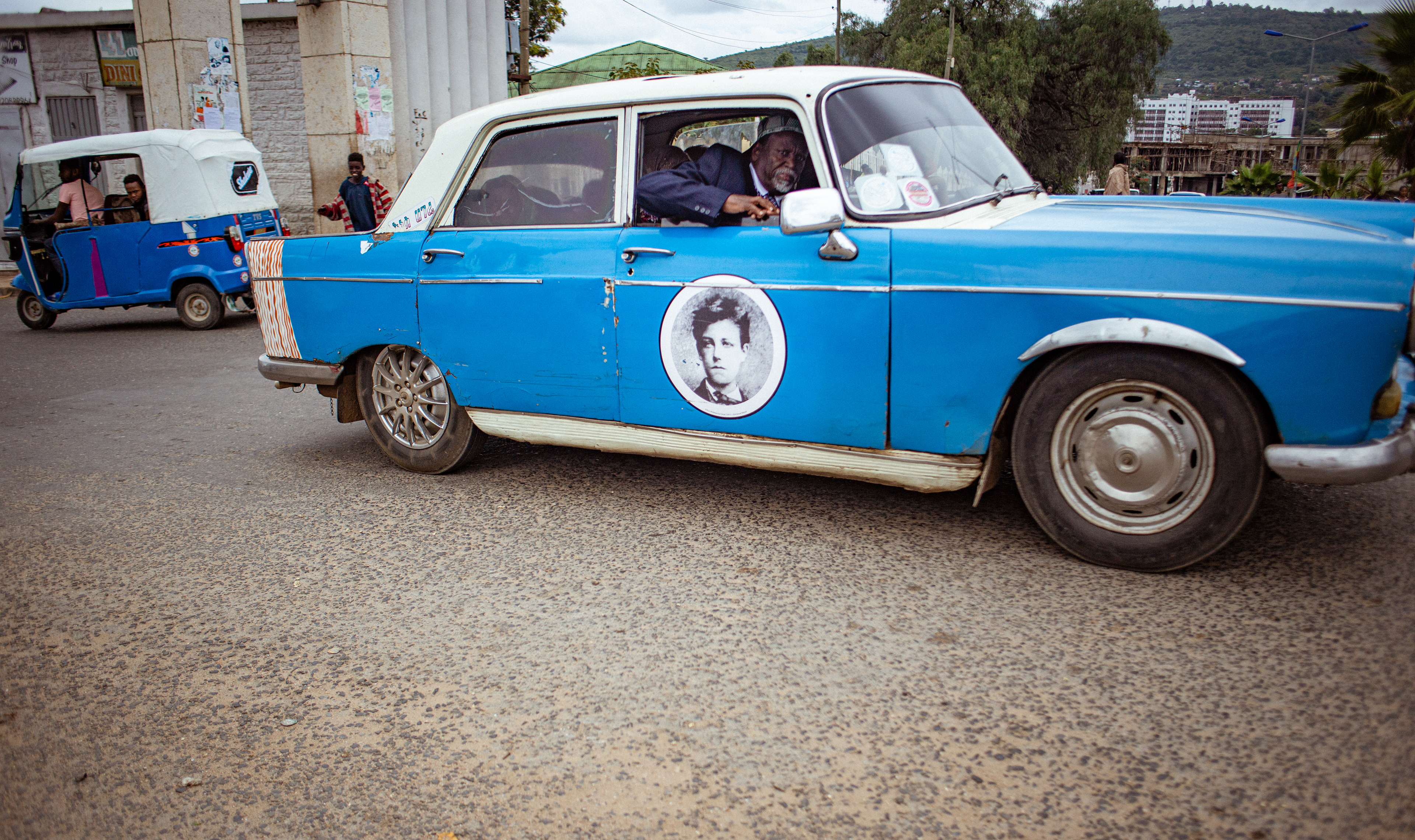 A portrait of the 19th French poet Arthur Rimbaud decorates one of the taxis. Rimbaud was famous for being one of the first foreigners to live in Harar and worked there as a merchant after finishing his literary career.