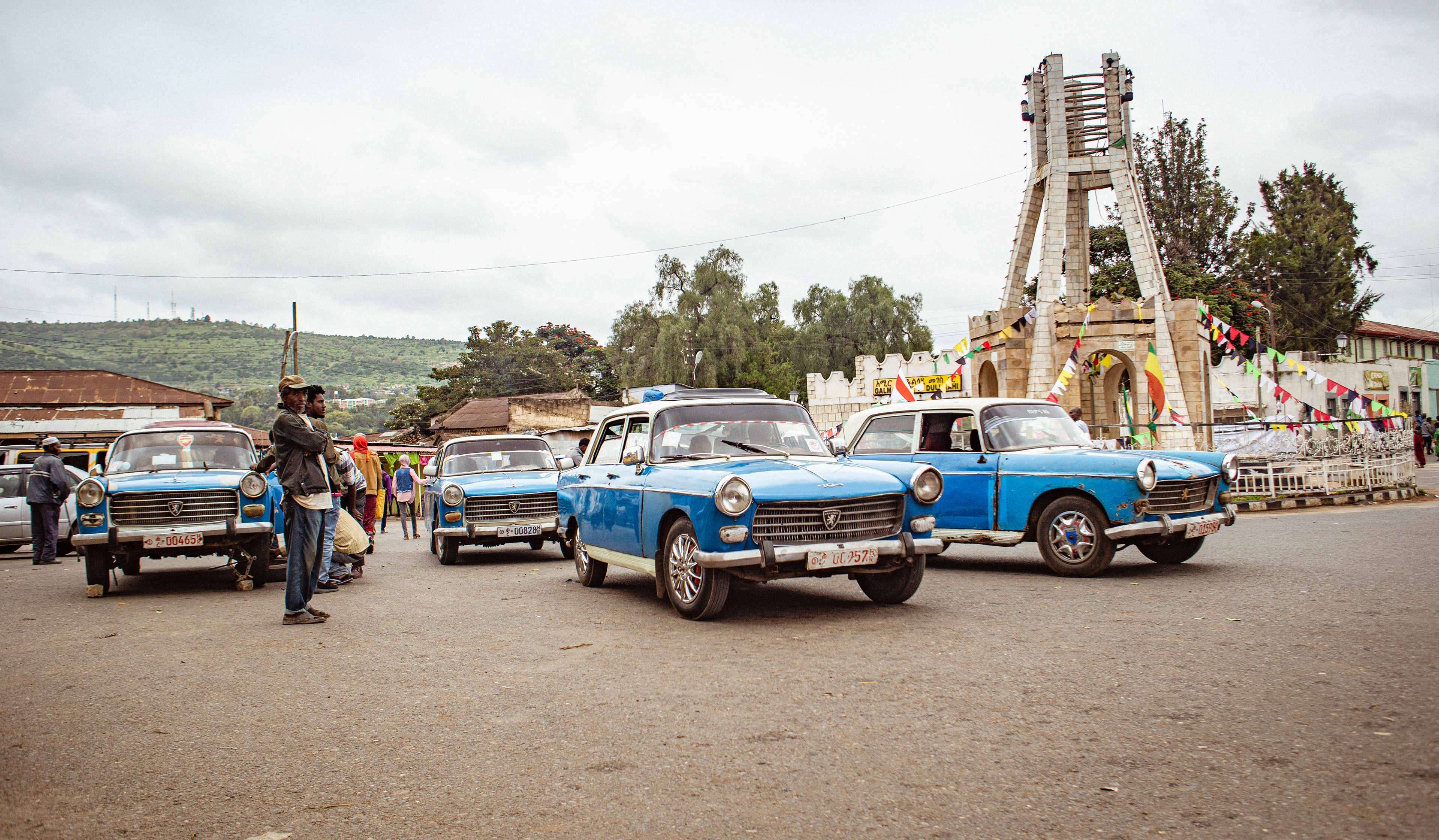 Drivers congregate in the central roundabout of Harar, which acts as both a meeting place, taxi depot and repair shop. 
