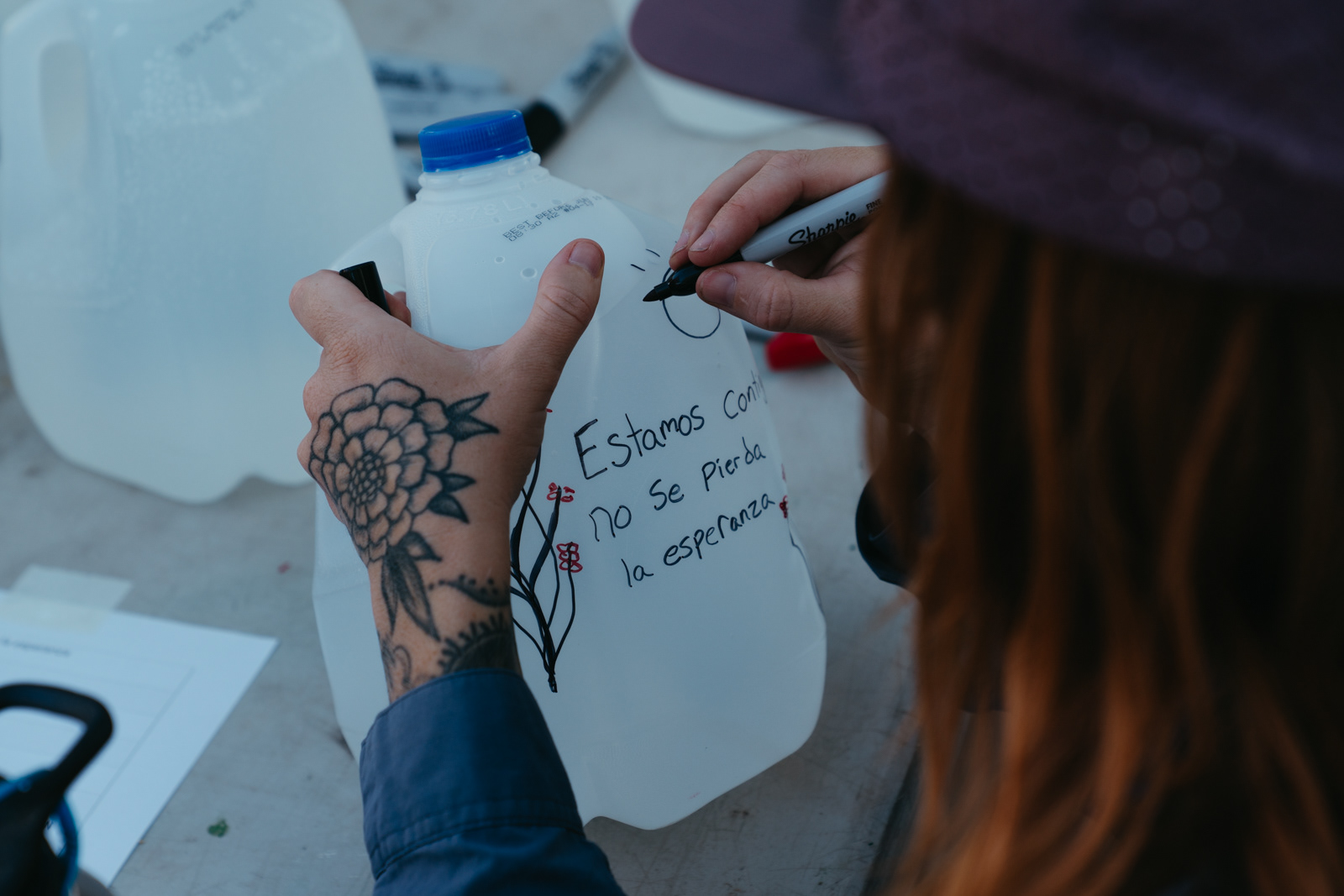 Decorating gallon jugs the night before the water drop.