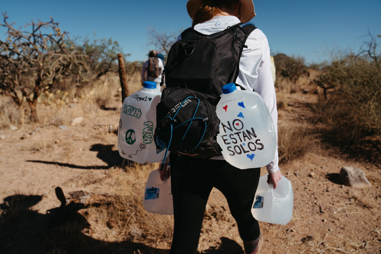 No More Deaths volunteers left gallons of water and canned foods on the weekend of the summer solstice to create a 'water line' through Arizona state trust land.