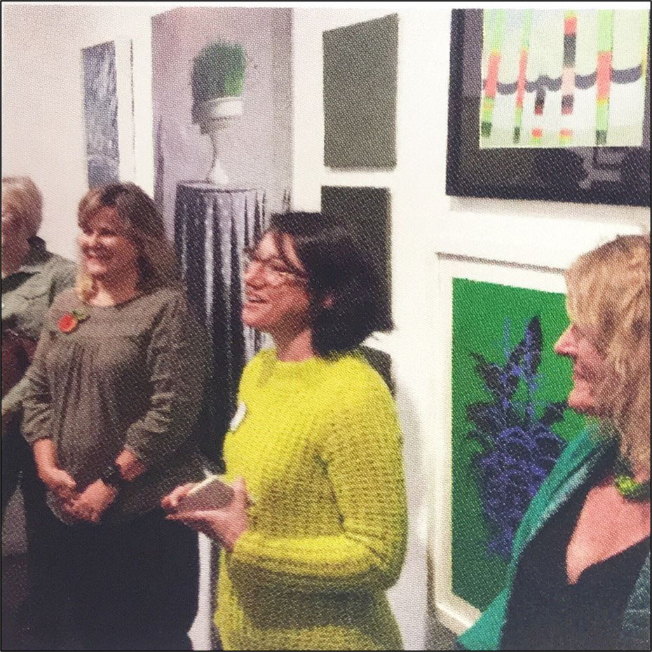 Exhibition juror Molly Casey (Center) during the opening reception