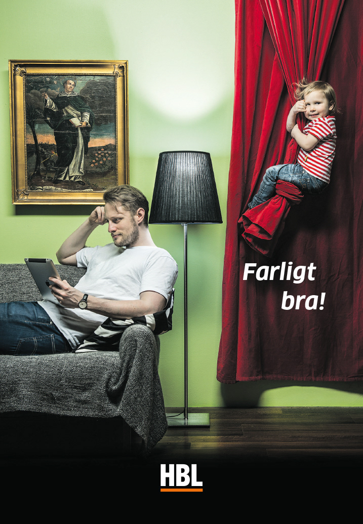 newsprint ad with child swinging from a curtain while the dad is absorbed by reading
