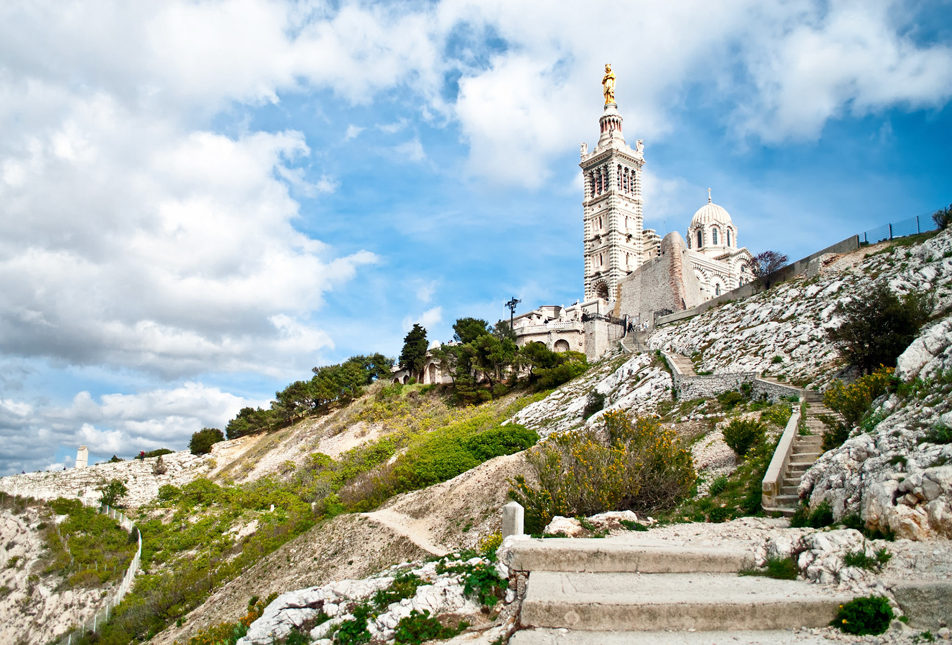 Notre-Dame de la Garde (literally Our Lady of the Guard), is a basilica in Marseille, France. This ornate Neo-Byzantine church is situated at the highest natural point in Marseille.
