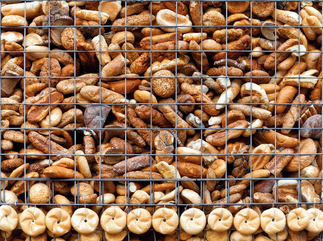 GRAZ, AUSTRIA - MAY 10: Fragment of the art-installation "Arc De Triomphe" with bread behind the grid situated on  Mariahilferplatz on May 10, 2012 in Graz. The message related to the considerable quantities of food that go to waste each year.
