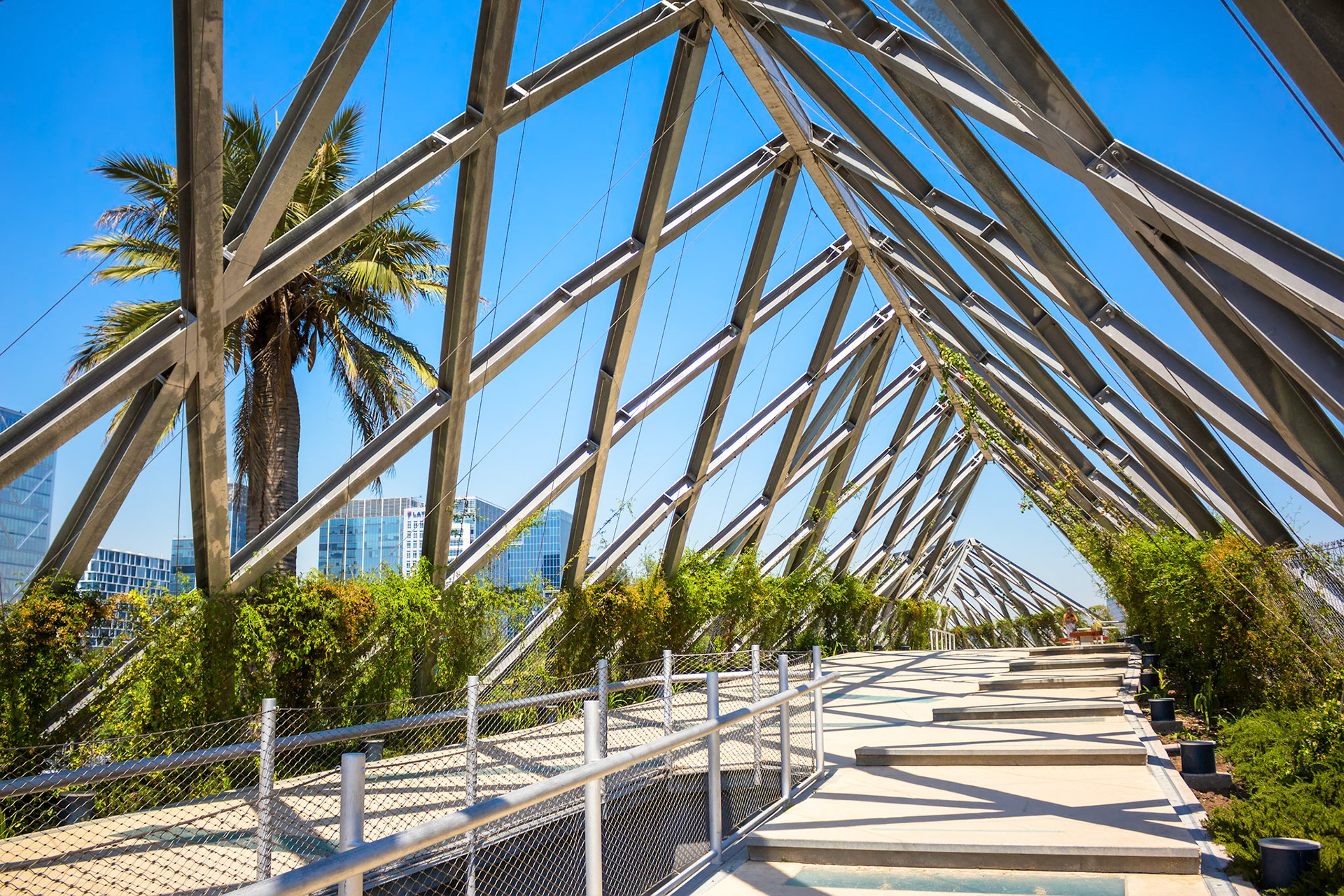 Pedestrian bridge between parks in  Barrio Nueva Las Condes in Santiago, Chile