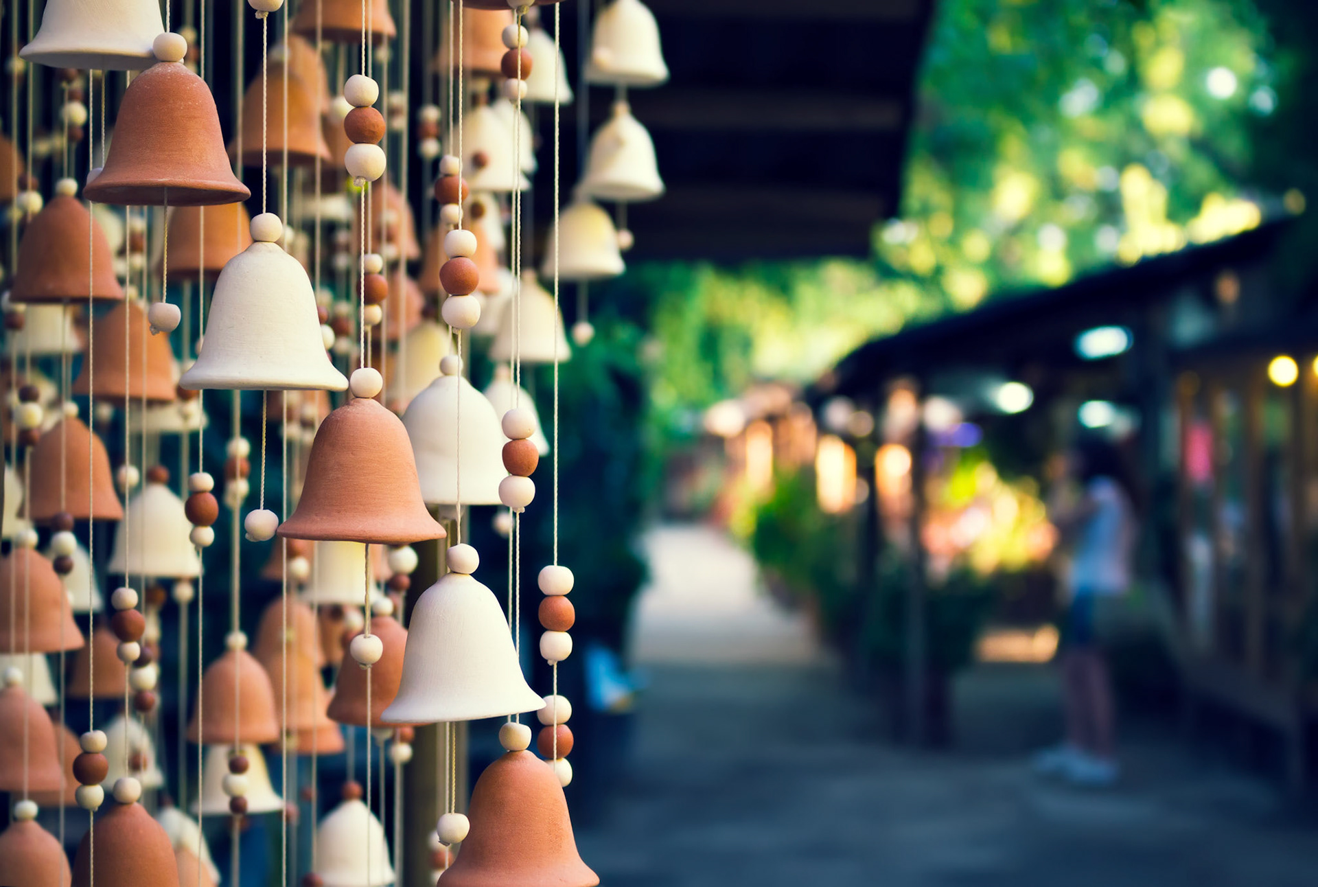 Hand made wind chimes hanging on a string with depth of field effect