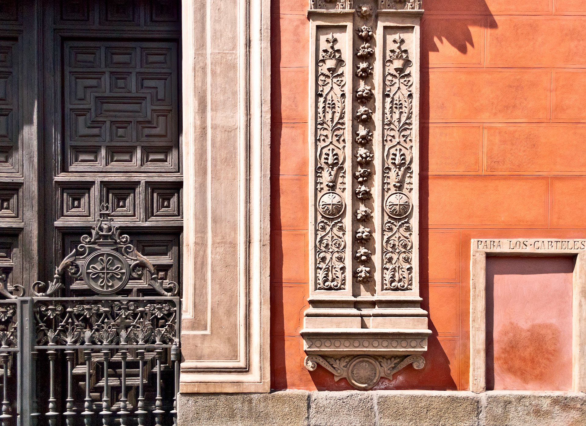 Typical spanish ornament on the wall and door in Madrid.