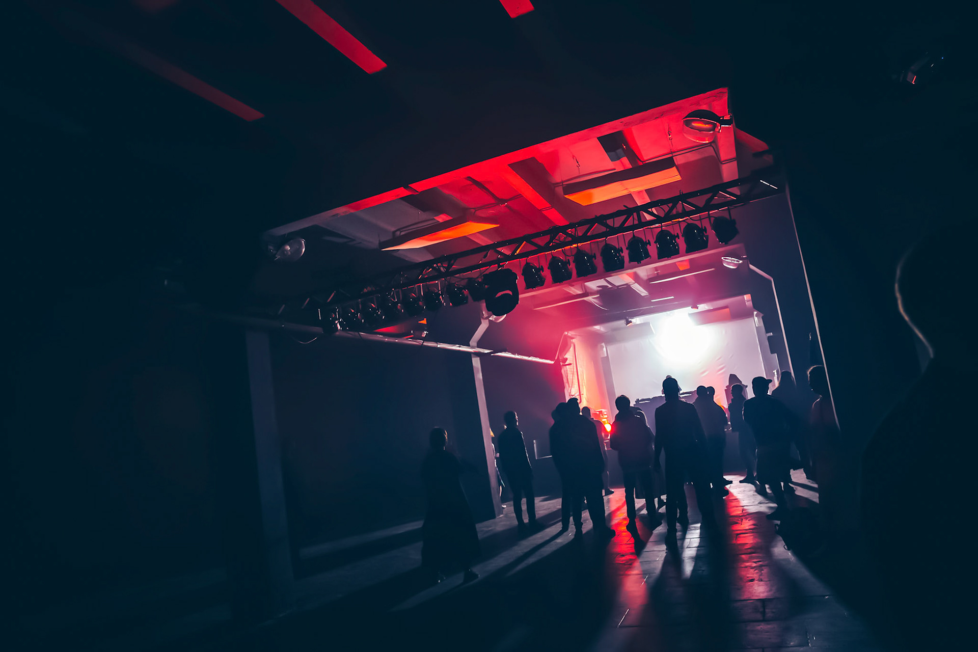 People silhouettes enjoing techno party in Moscow club