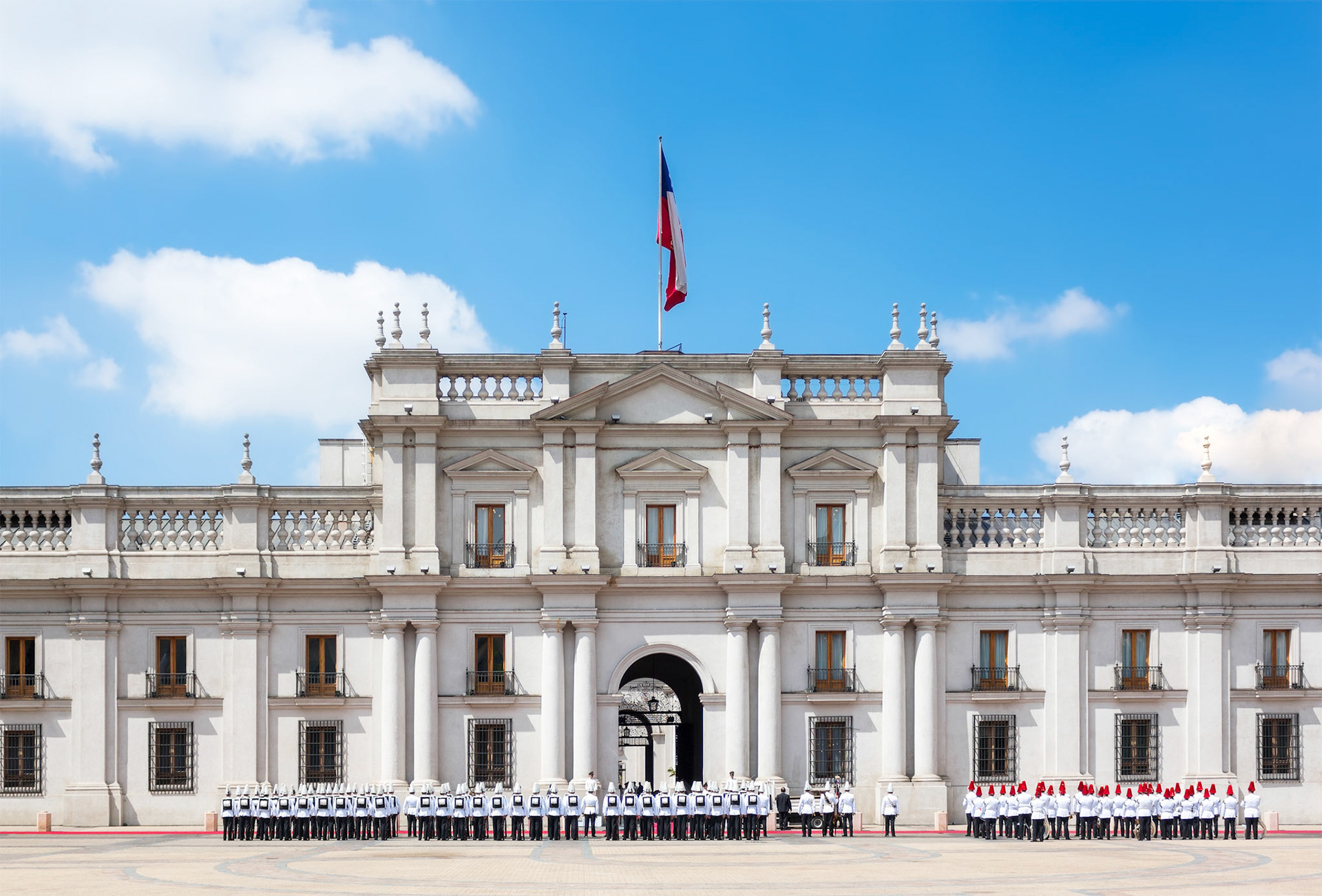 A public procession in front of La Moneda Palace (Palacio de La Moneda) in Santiago, Chile.