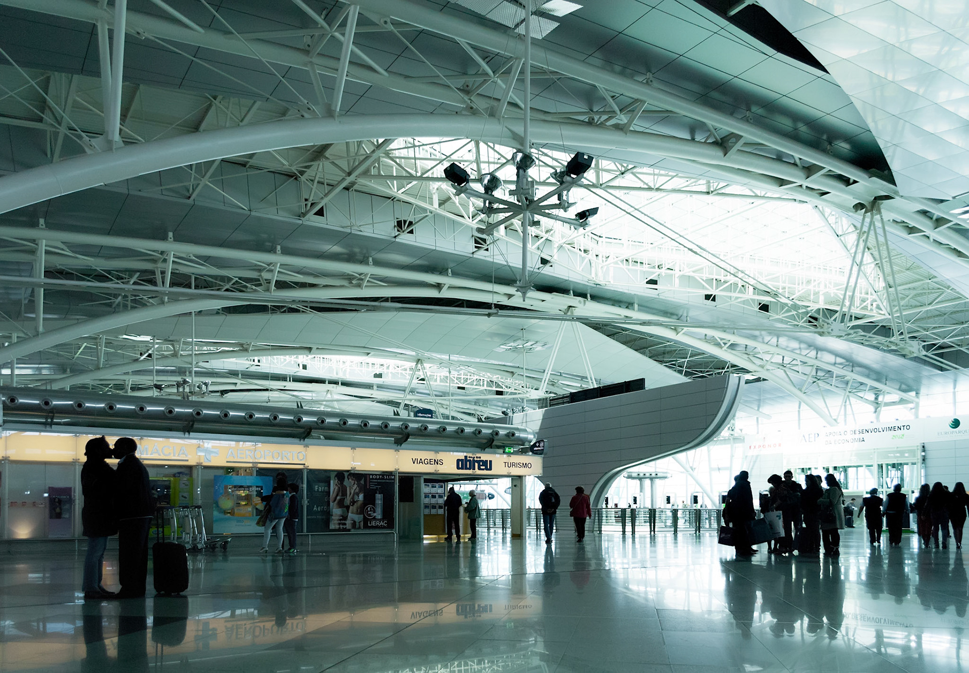 Parting lovers in modern airport "Francisco Sa Carneiro" in Porto, Portugal