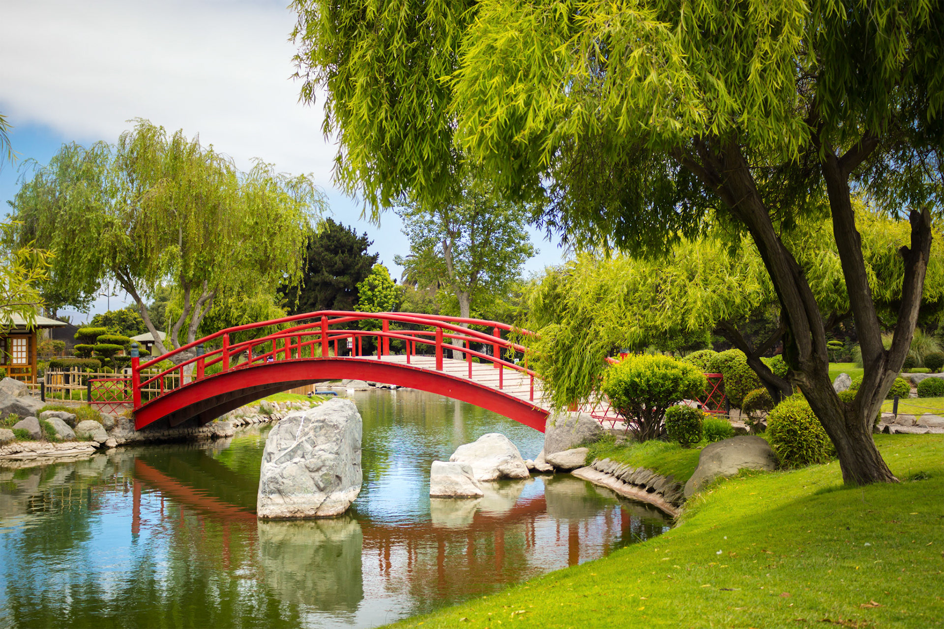 Beautiful red bridge under pond in japanese garden in La Serena, Chile