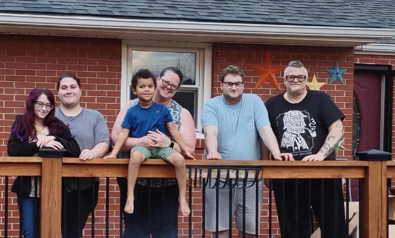My immediate family standing in front of our new house.