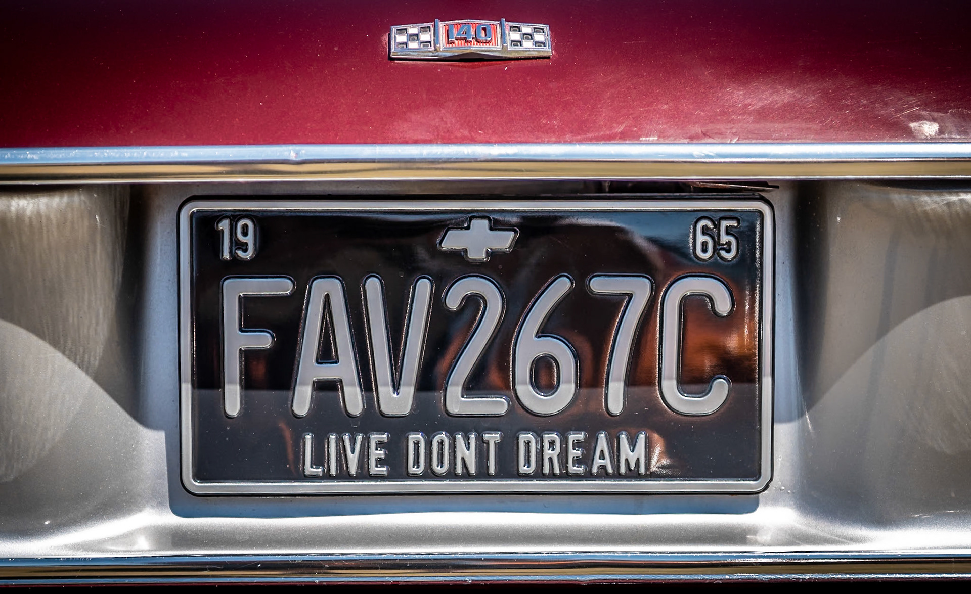 Licence plate with the slogan "Live dont dream at The Rally of the Giants, classic American car show, in the grounds of Blenheim Palace, Woodstock.
