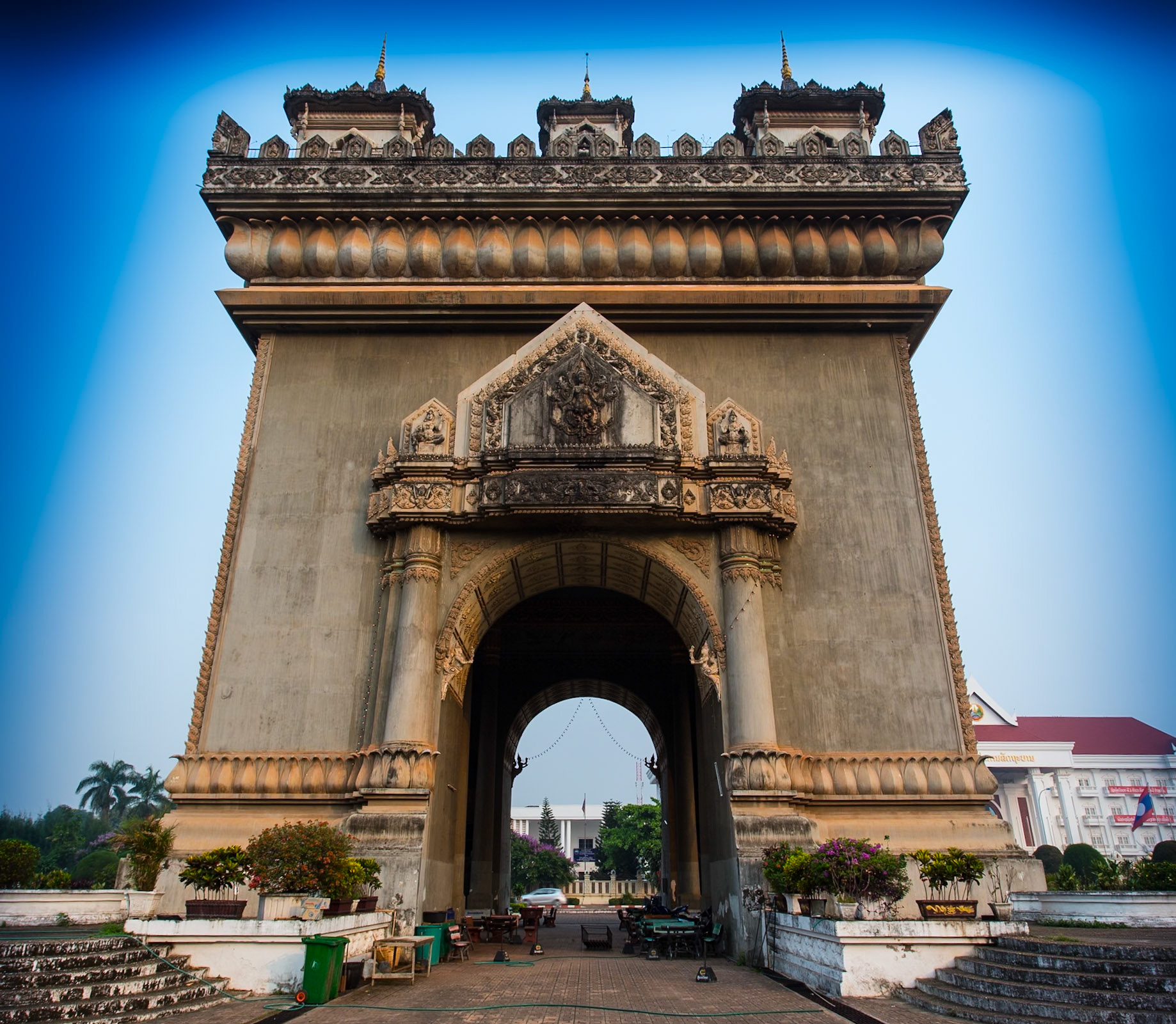 Patuxai (Lao: ປະຕູໄຊ, literally meaning Victory Gate or Gate of Triumph, formerly the Anousavary or Anosavari Monumentm known by the French as Monument Aux Morts) is a war monument in the centre of Vientiane, Laos, which was built between 1957 and 1968. Patuxai is dedicated to those who fought in the struggle for independence from France. In romanising the name from the Laotian language, it is variously transliterated as Patuxai, Patuxay, Patousai and Patusai. It is also given the name of Patuxai Arch or the Asian version of Arc de Triomphe of Vientiane as it has general resemblance to the Arc de Triomphe in Paris; however, it is typically Laotian in design, decorated with many Buddhist mythological figurines such as of kinnari (half-female, half-bird figures).